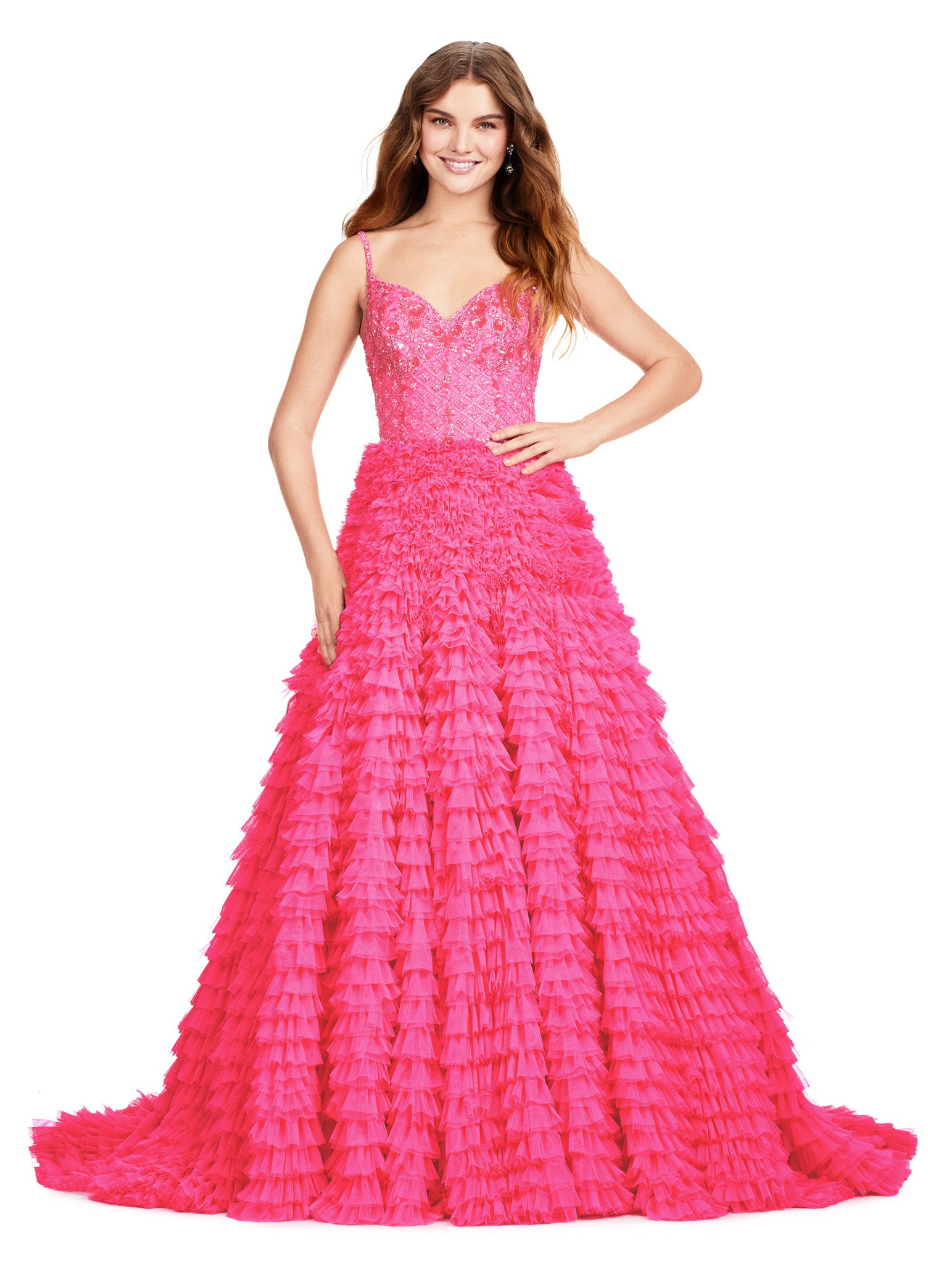 Elegant pink ball gown featuring a fitted bodice with delicate lace details and a full-tiered ruffle skirt extending into a dramatic train.