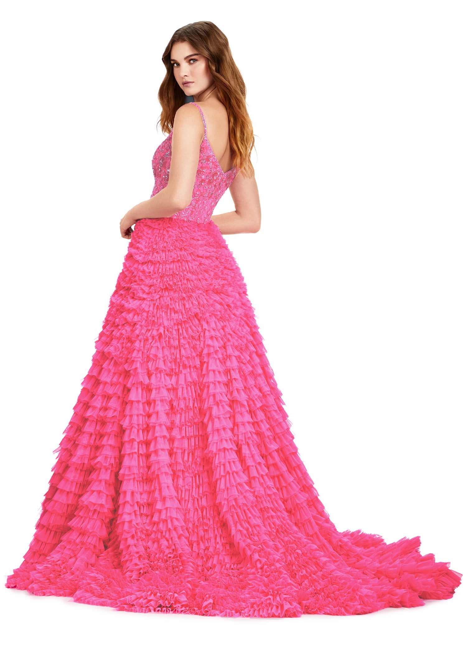 Back view of an elegant pink ball gown featuring a fitted bodice with delicate lace details and a full-tiered ruffle skirt extending into a dramatic train.