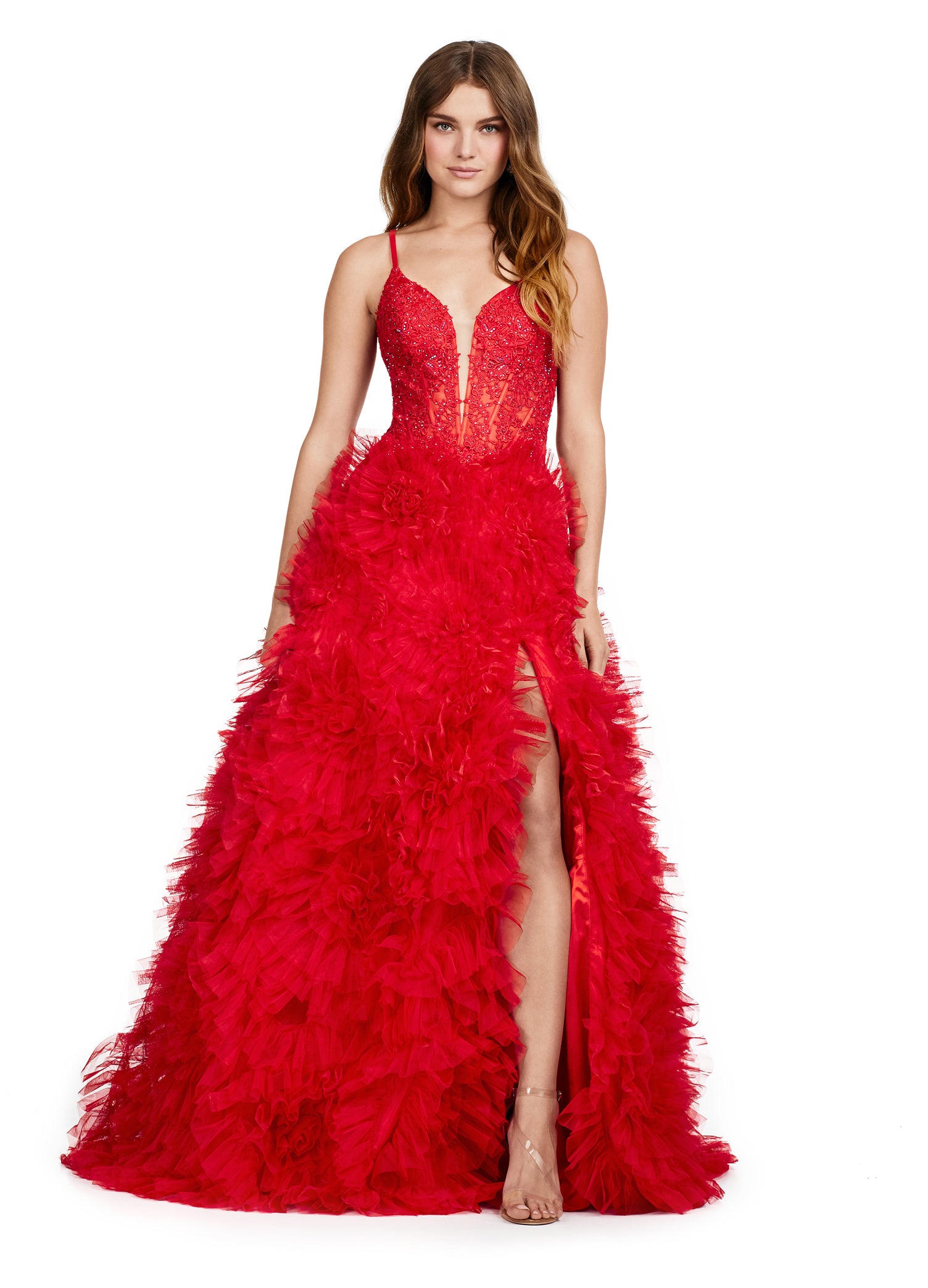 Elegant red evening gown with a plunging neckline, lace bodice, and a dramatic tiered ruffle skirt with a high slit.