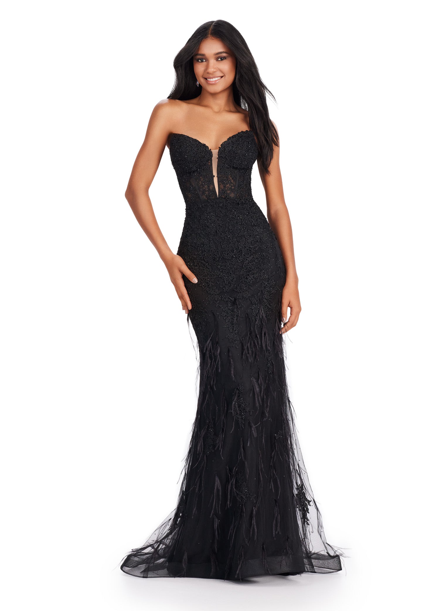 Elegant strapless black gown with a deep plunging neckline, featuring intricate beading and feather embellishments, flowing into a fitted silhouette and delicate tulle skirt.