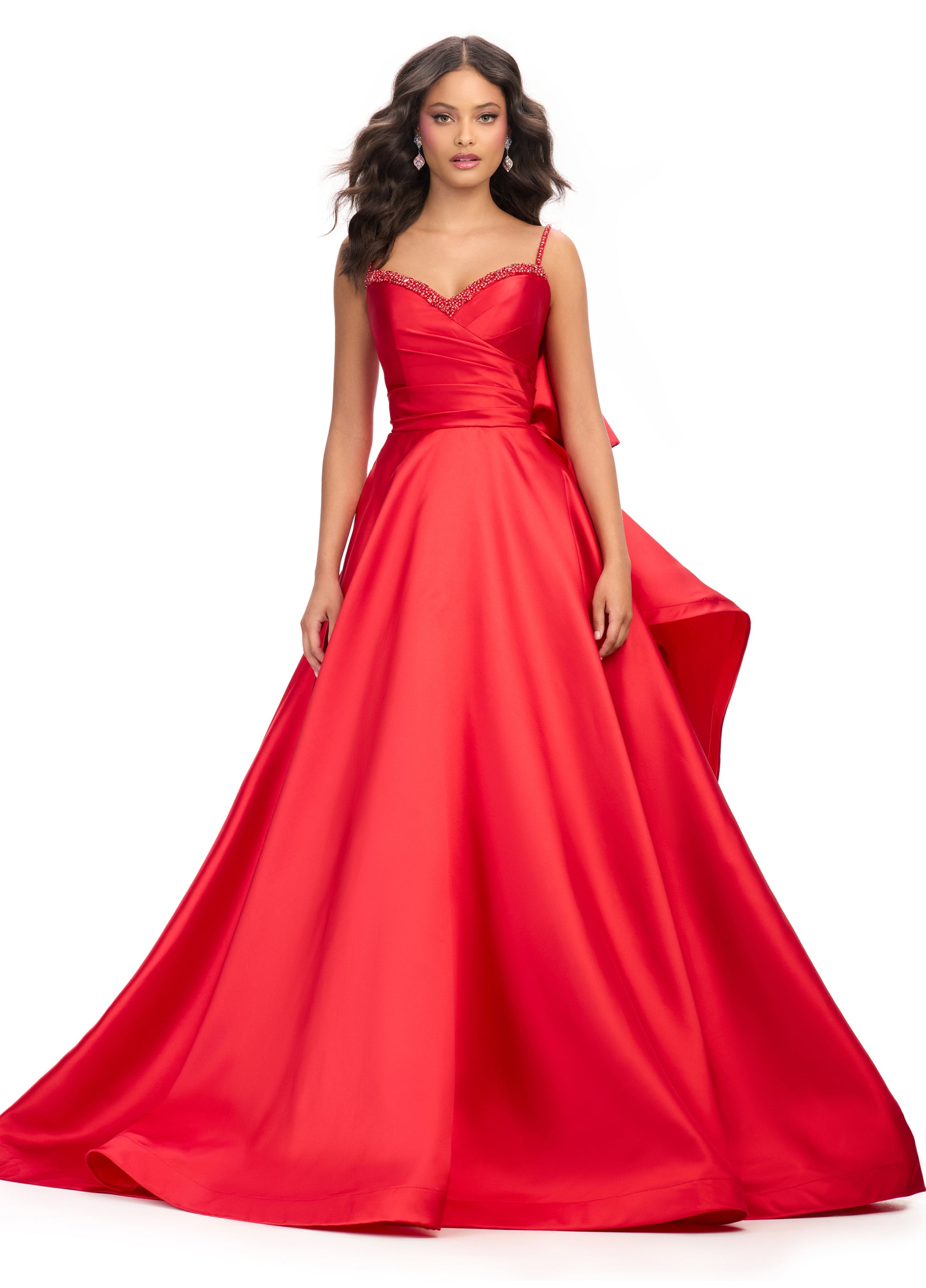 Classic red A-line gown with beaded straps and sweetheart neckline and avant garde bow back
