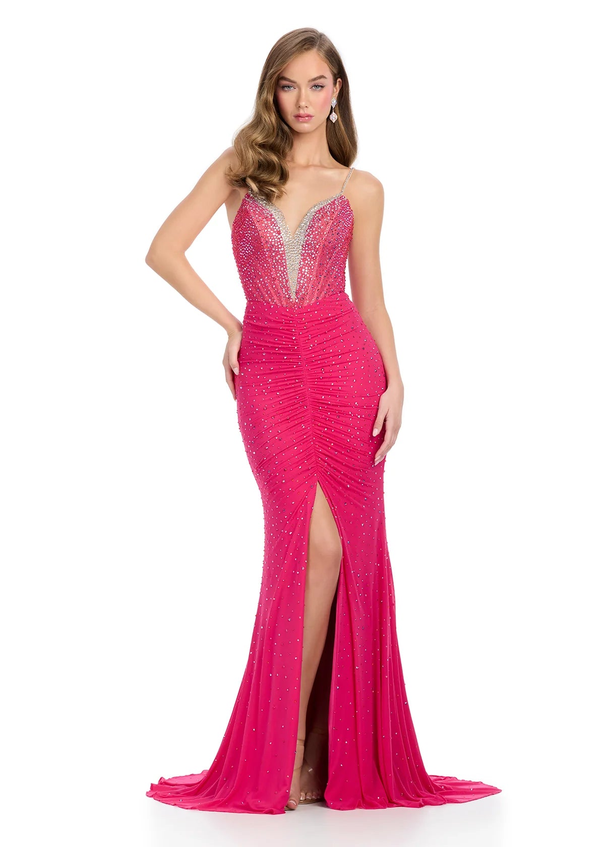 Fuchsia sweetheart neckline evening gown featuring intricate beaded embellishments, a ruched bodice, and a high slit for an elegant and glamorous look.