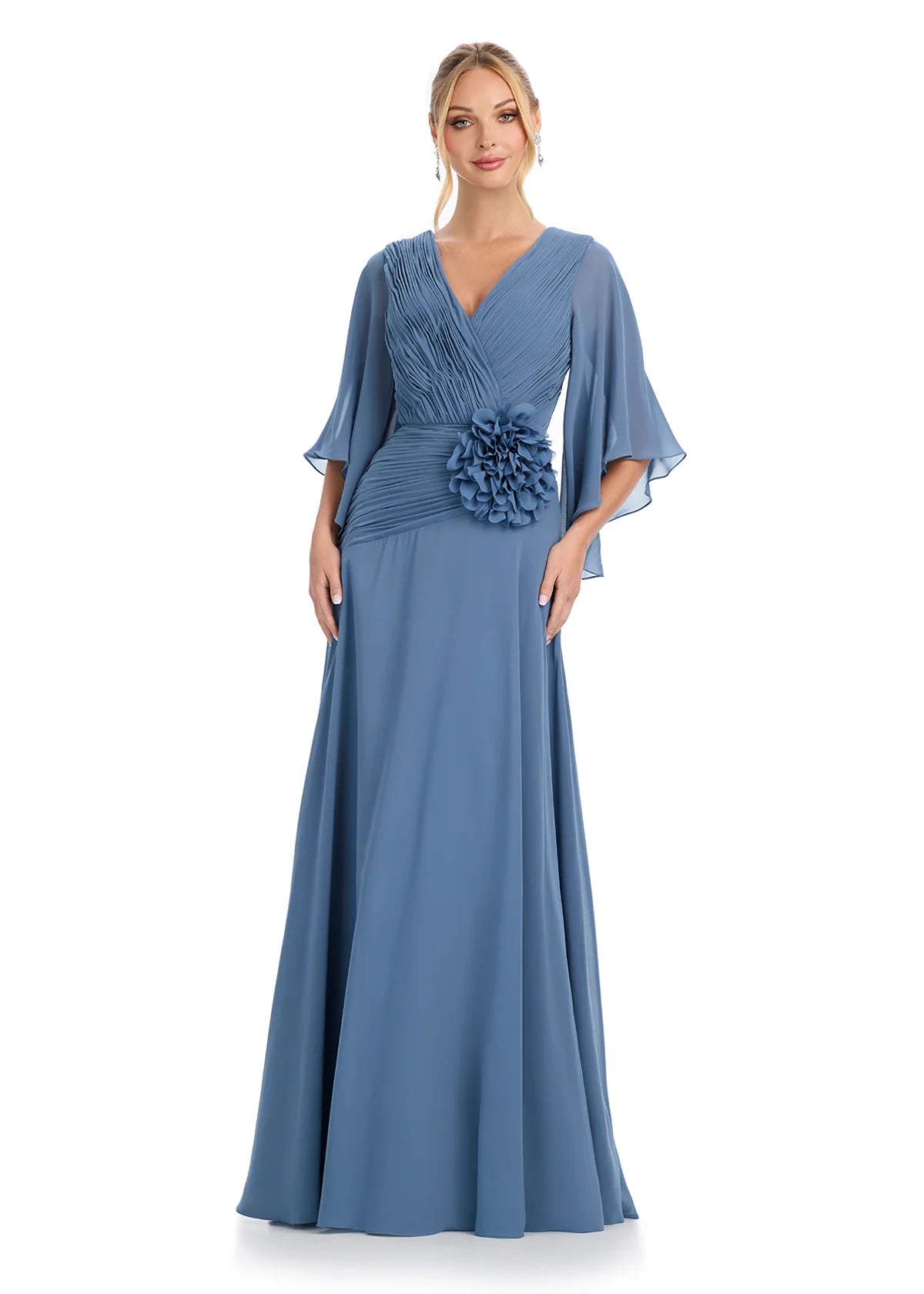 Graceful V-neck gown with flutter sleeves, pleated bodice detailing, and a statement floral embellishment at the waist, offering timeless sophistication.