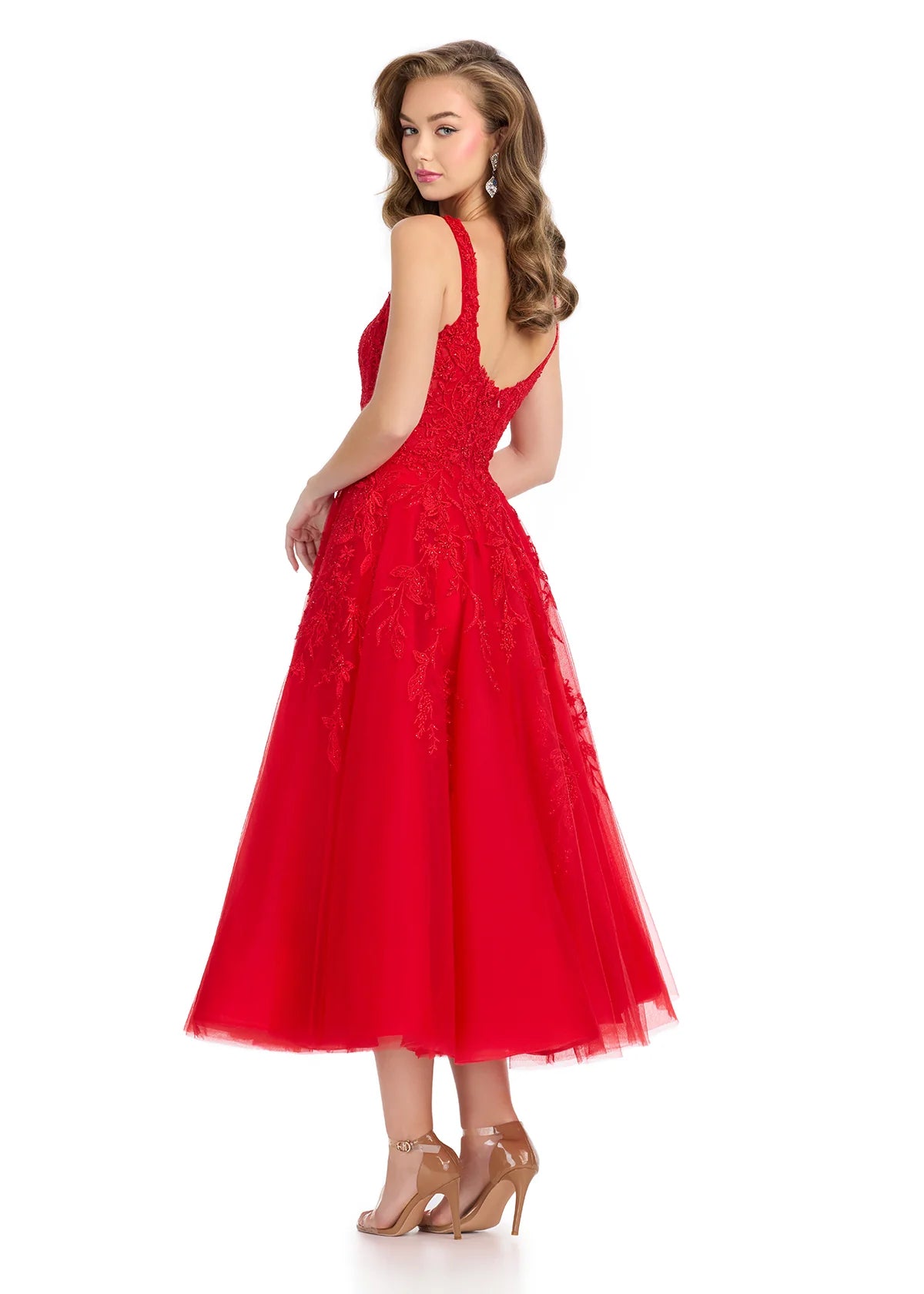 Back view - Red midi dress featuring a sheer lace bodice with intricate beadwork, wide straps, and a voluminous A-line skirt, combining sophistication with modern elegance.