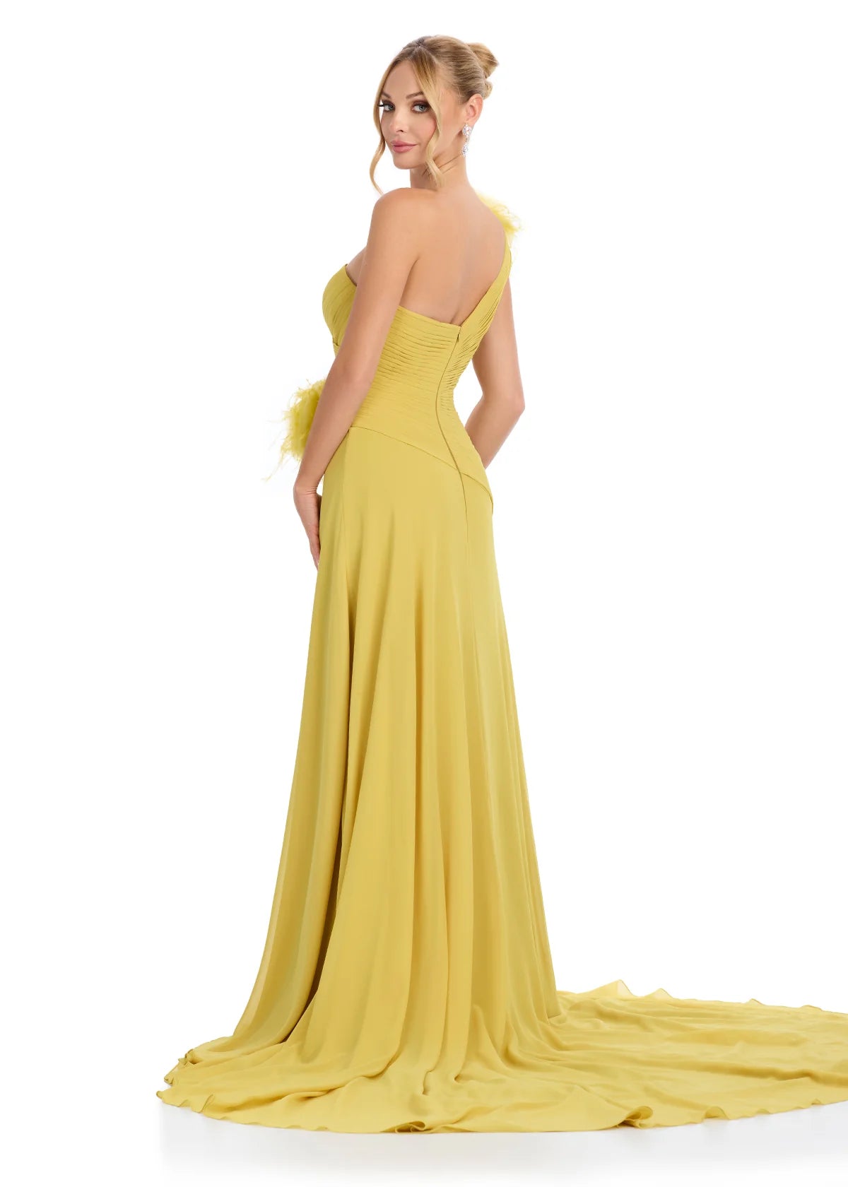 Back view - Elegant mustard one-shoulder gown with feather and floral embellishments, featuring a ruched bodice, thigh-high slit, and flowing train for a dramatic and sophisticated look.