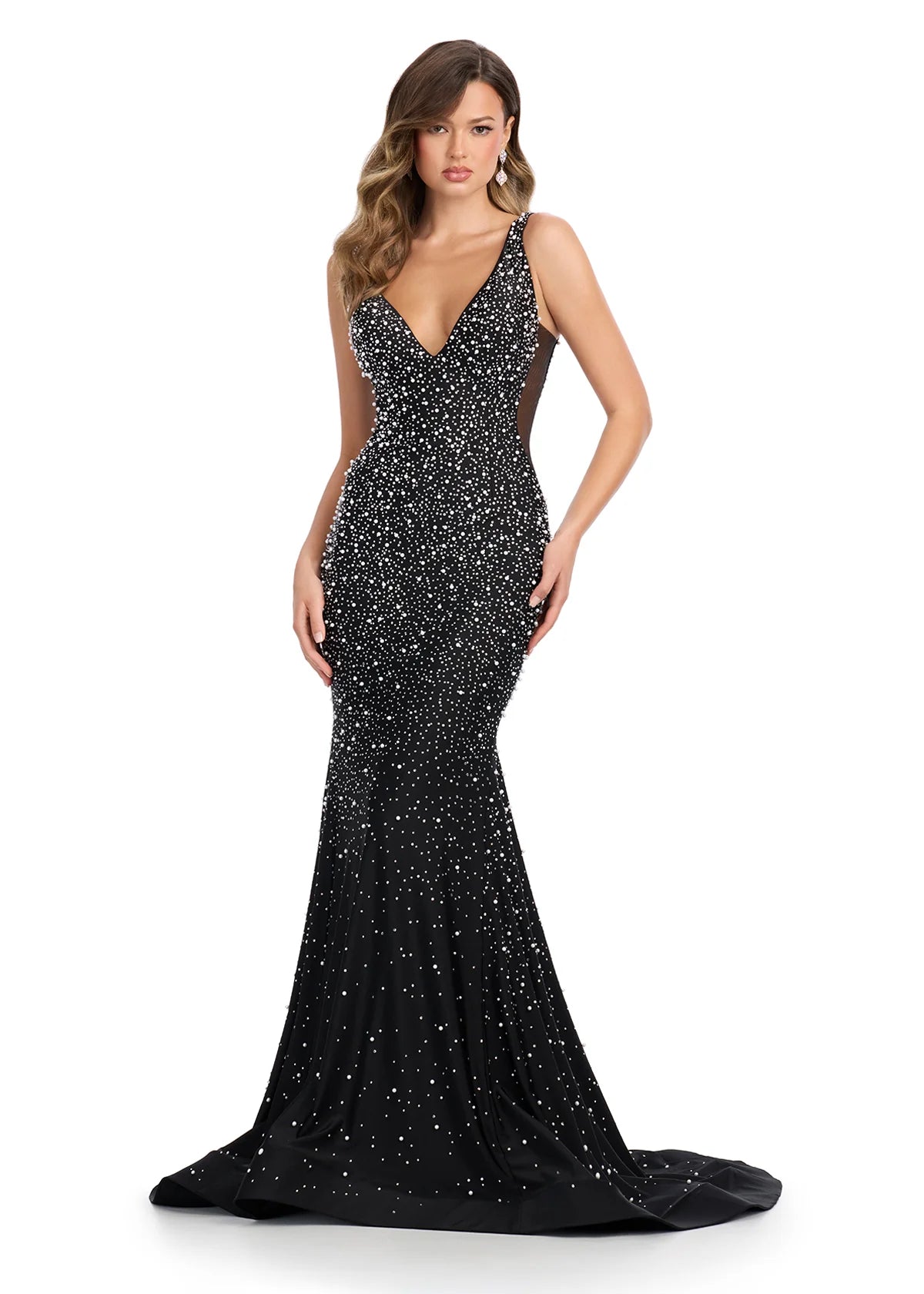 Black v-neck fitted evening gown embellished with scattered crystals, featuring sheer side panels and a dramatic floor-sweeping train for a sophisticated and dazzling look.