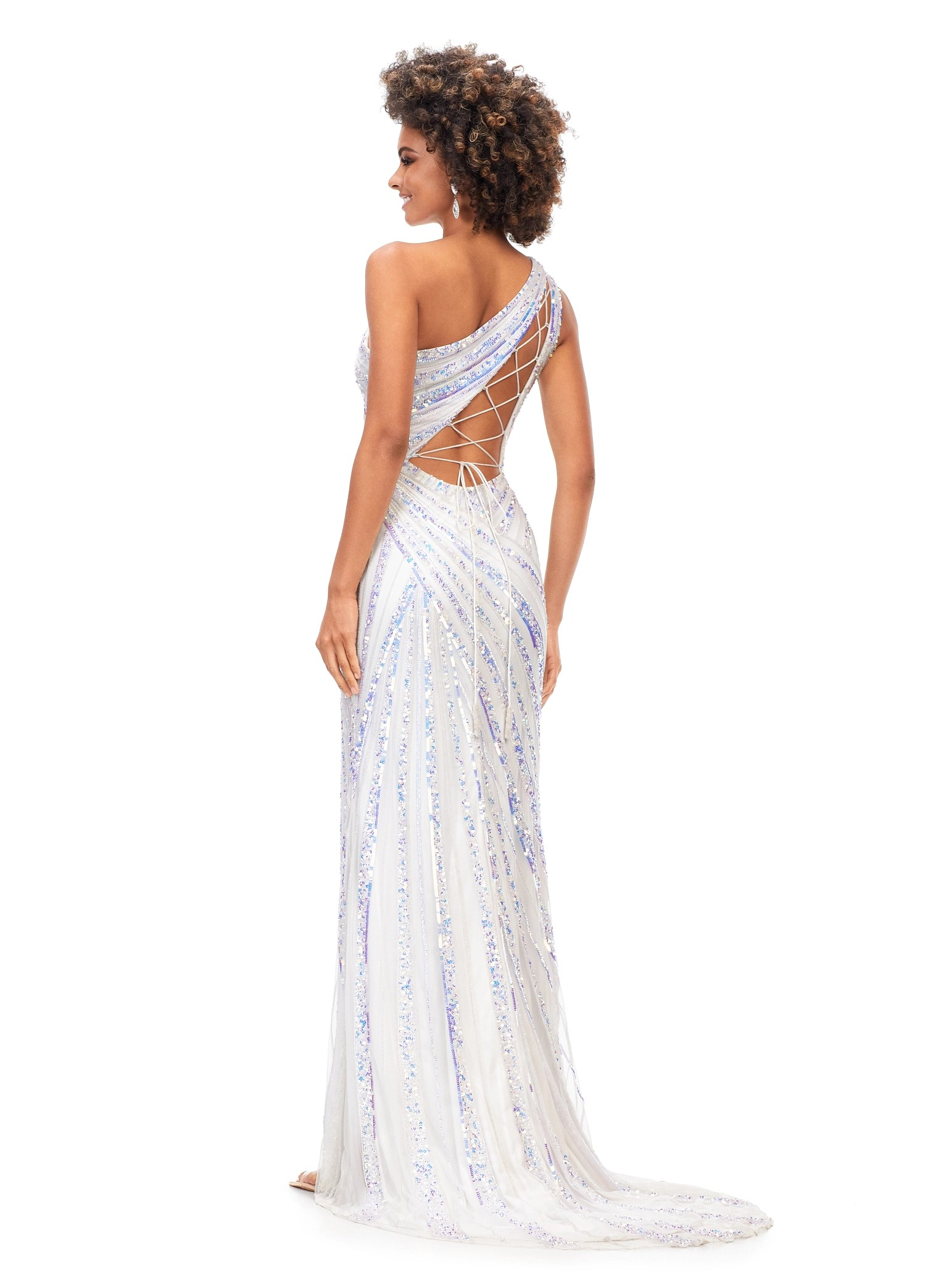 Back View - Stunning white one-shoulder gown embellished with intricate sequins, offering a high slit for a glamorous finish.
