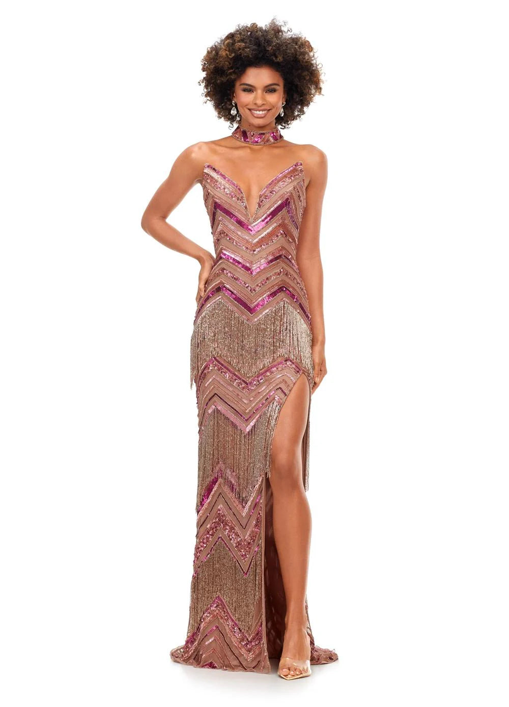 Eye-catching bronze and pink floor-length gown featuring a plunging neckline, chevron beadwork, fringe detailing, a matching choker, and a thigh-high slit for a bold and glamorous look.