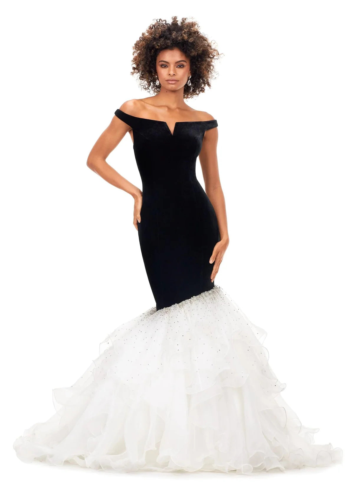 A stunning off-the-shoulder mermaid gown crafted from luxurious velvet, featuring a plunging sweetheart neckline and transitioning into a voluminous organza skirt adorned with shimmering embellishments for an elegant black-and-white contrast.