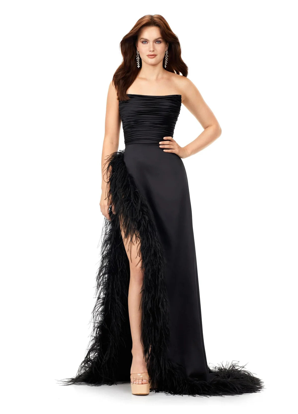 Elegant strapless evening gown featuring a ruched bodice and a dramatic feather-trimmed slit, exuding timeless sophistication and modern flair.