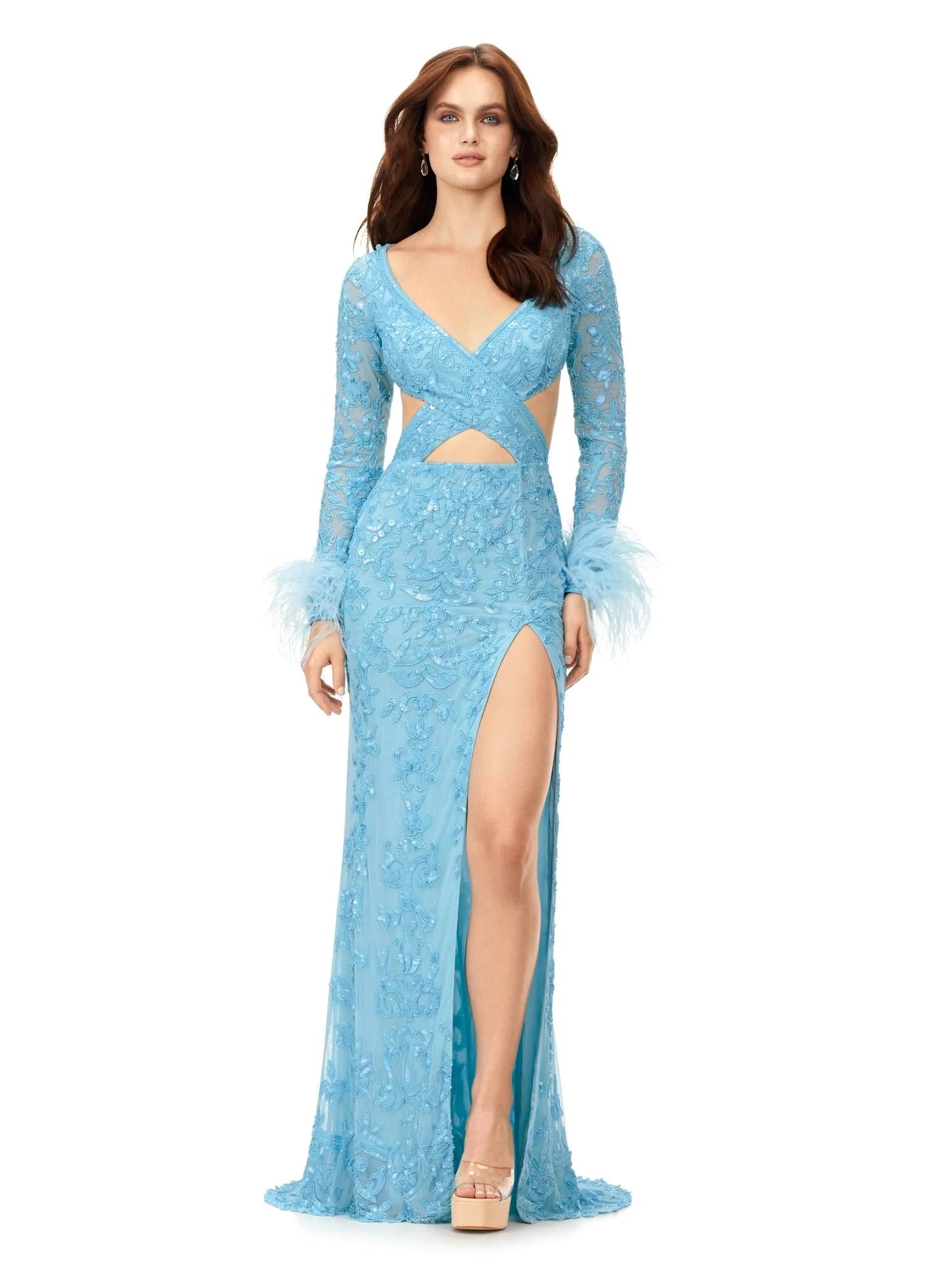 Powder blue gown featuring intricate embroidery, long sheer sleeves, feathered cuffs, a daring cutout waistline, and a high slit for a chic and elegant look.