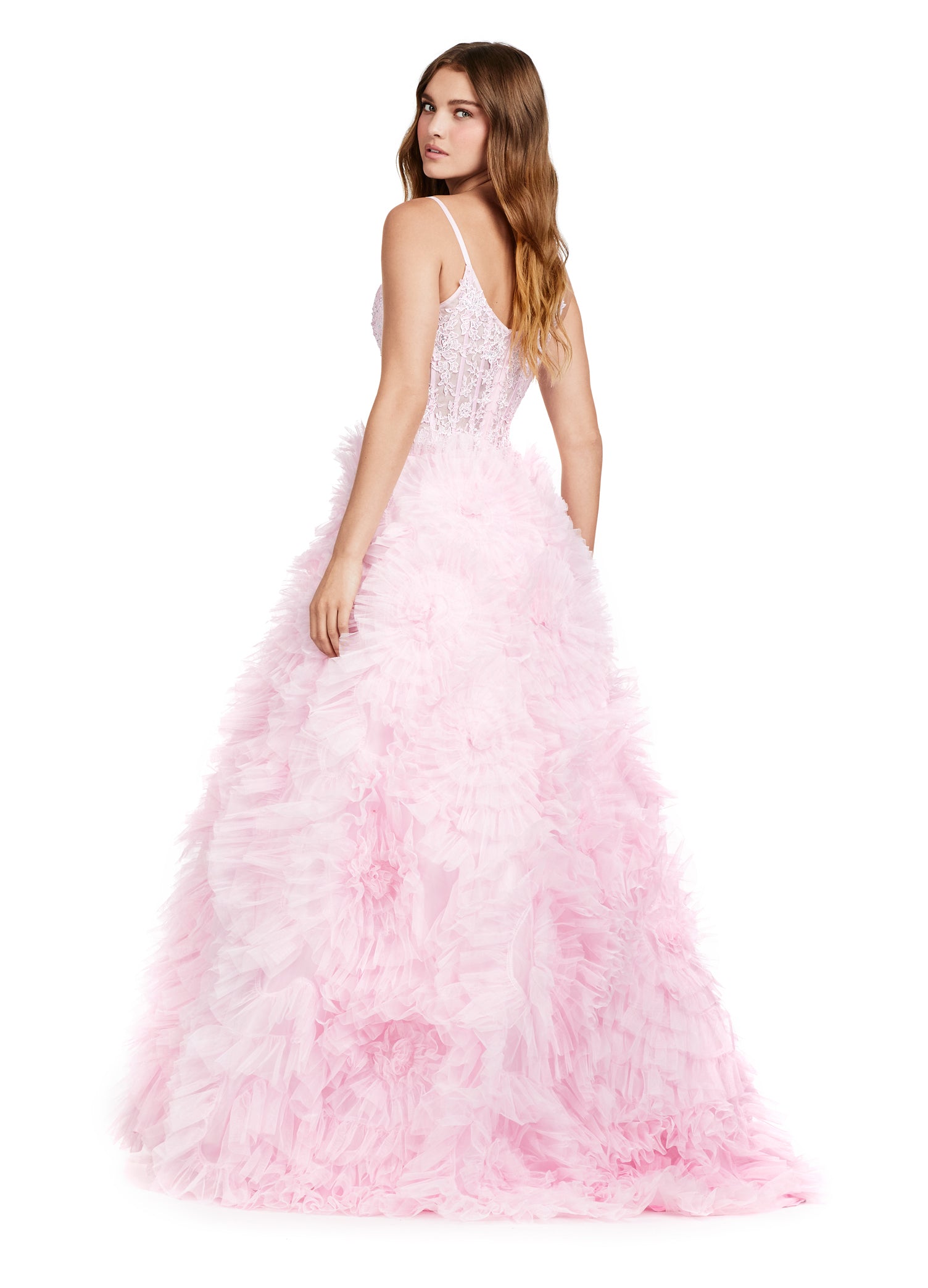 Elegant pink evening gown with a plunging neckline, lace bodice, and a dramatic tiered ruffle skirt with a high slit.