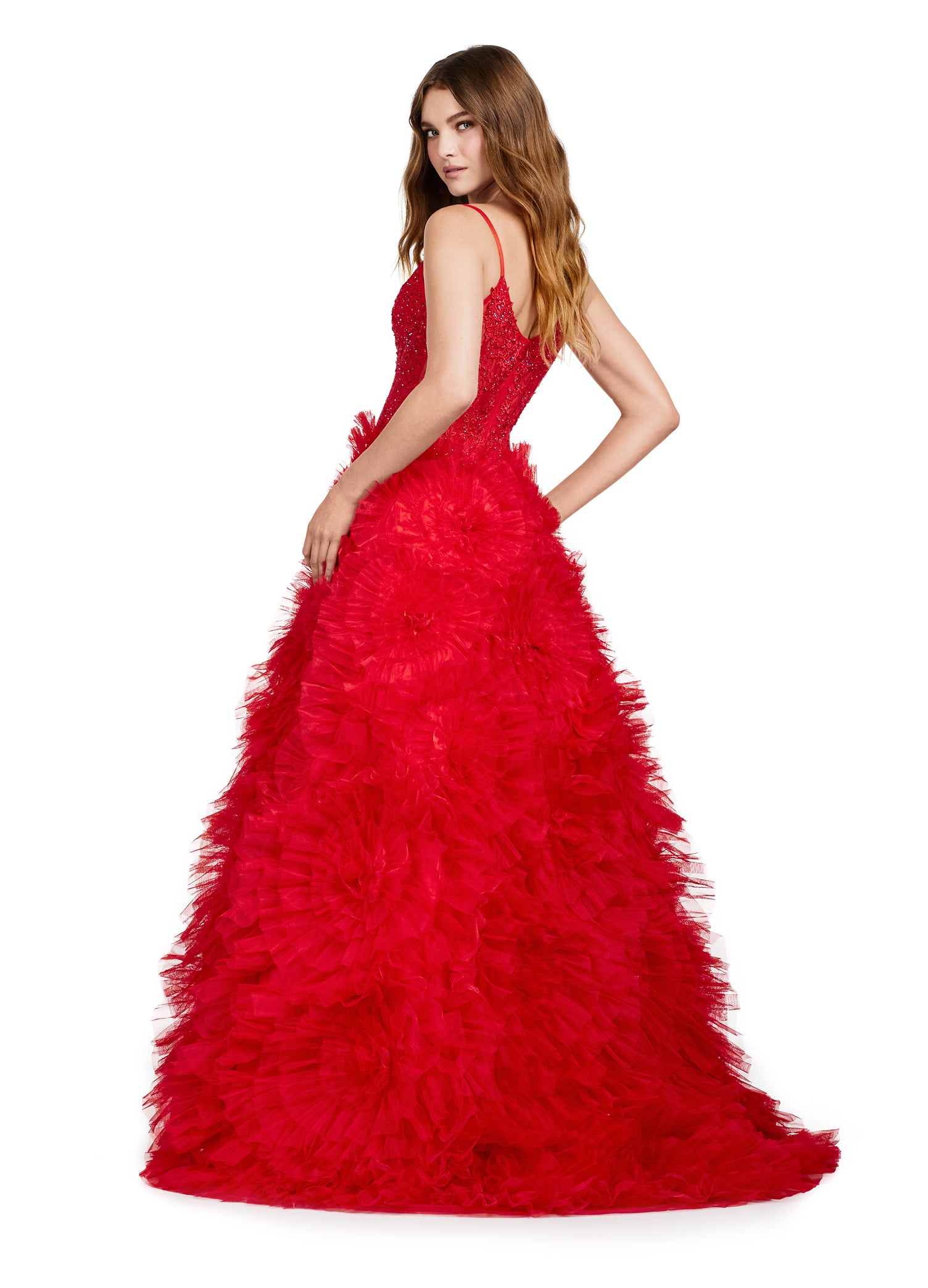 Elegant red evening gown with a plunging neckline, lace bodice, and a dramatic tiered ruffle skirt with a high slit.