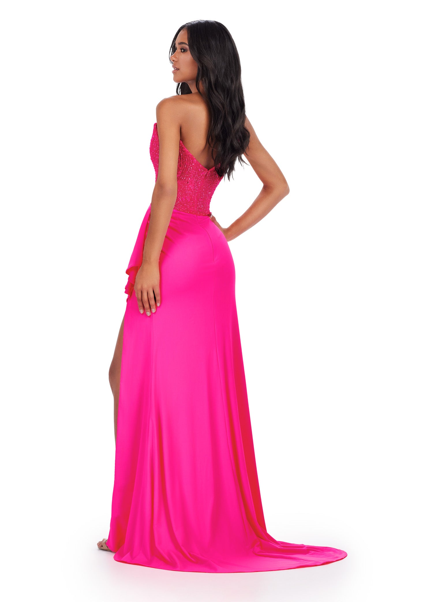 Vibrant pink strapless gown with a sequinned bodice and high-slit skirt, ideal for luxury evening wear and formal occasions.