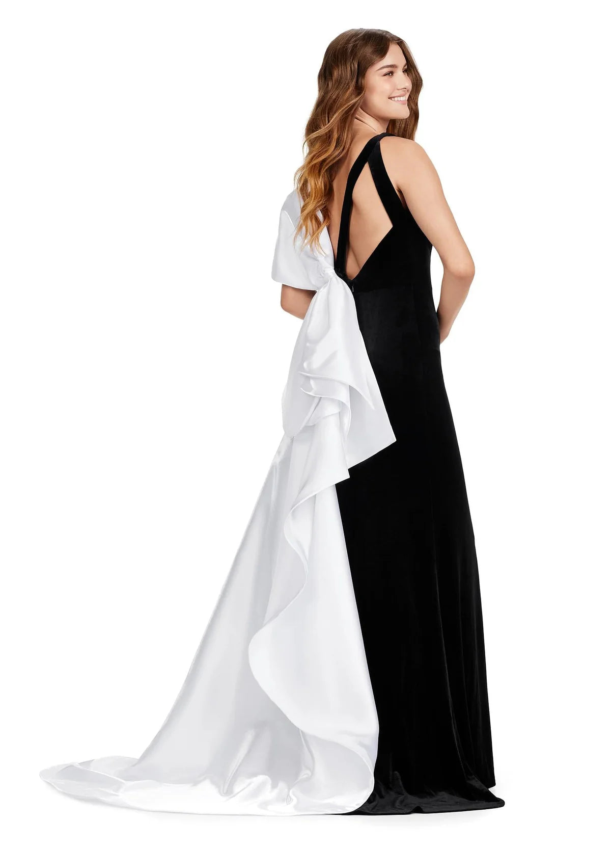 Back view of a black velvet evening gown with a low back and an elegant white cascading train, adding a striking contrast and a touch of sophistication.