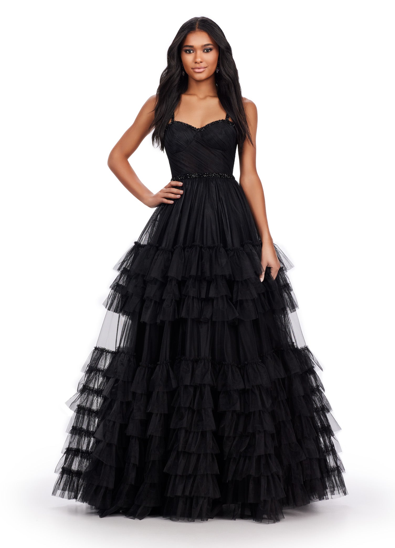 Black ball gown with a sweetheart neckline, fitted bodice, embellished waistband, and tiered tulle skirt.