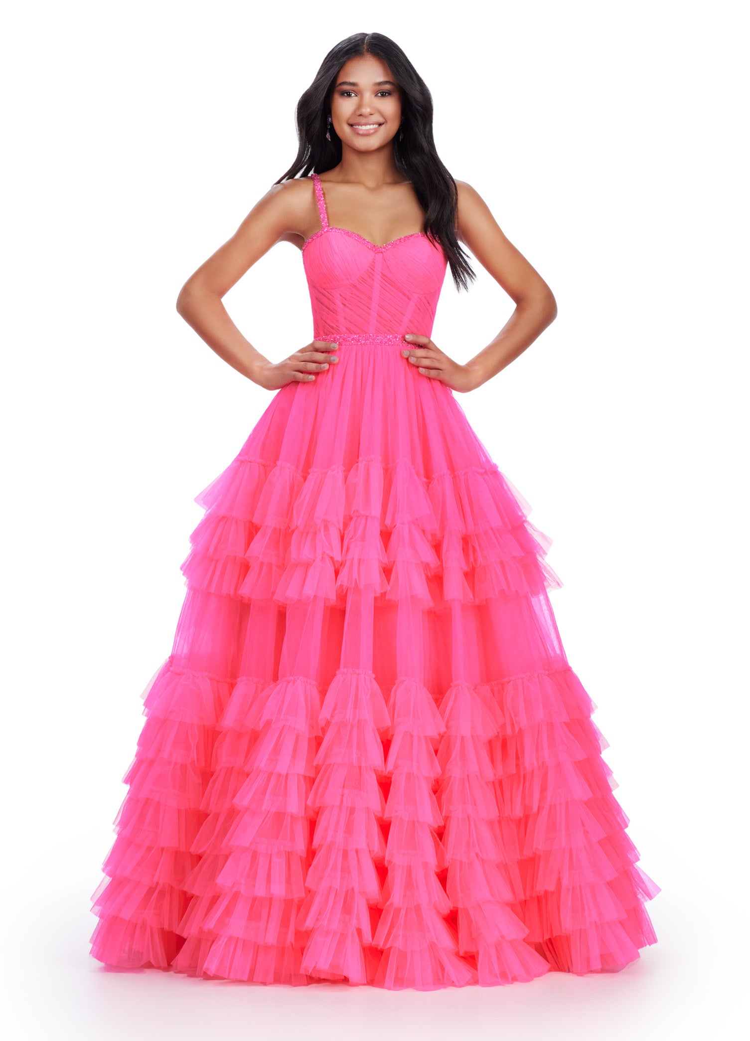 Hot Pink ball gown with a sweetheart neckline, fitted bodice, embellished waistband, and tiered tulle skirt.