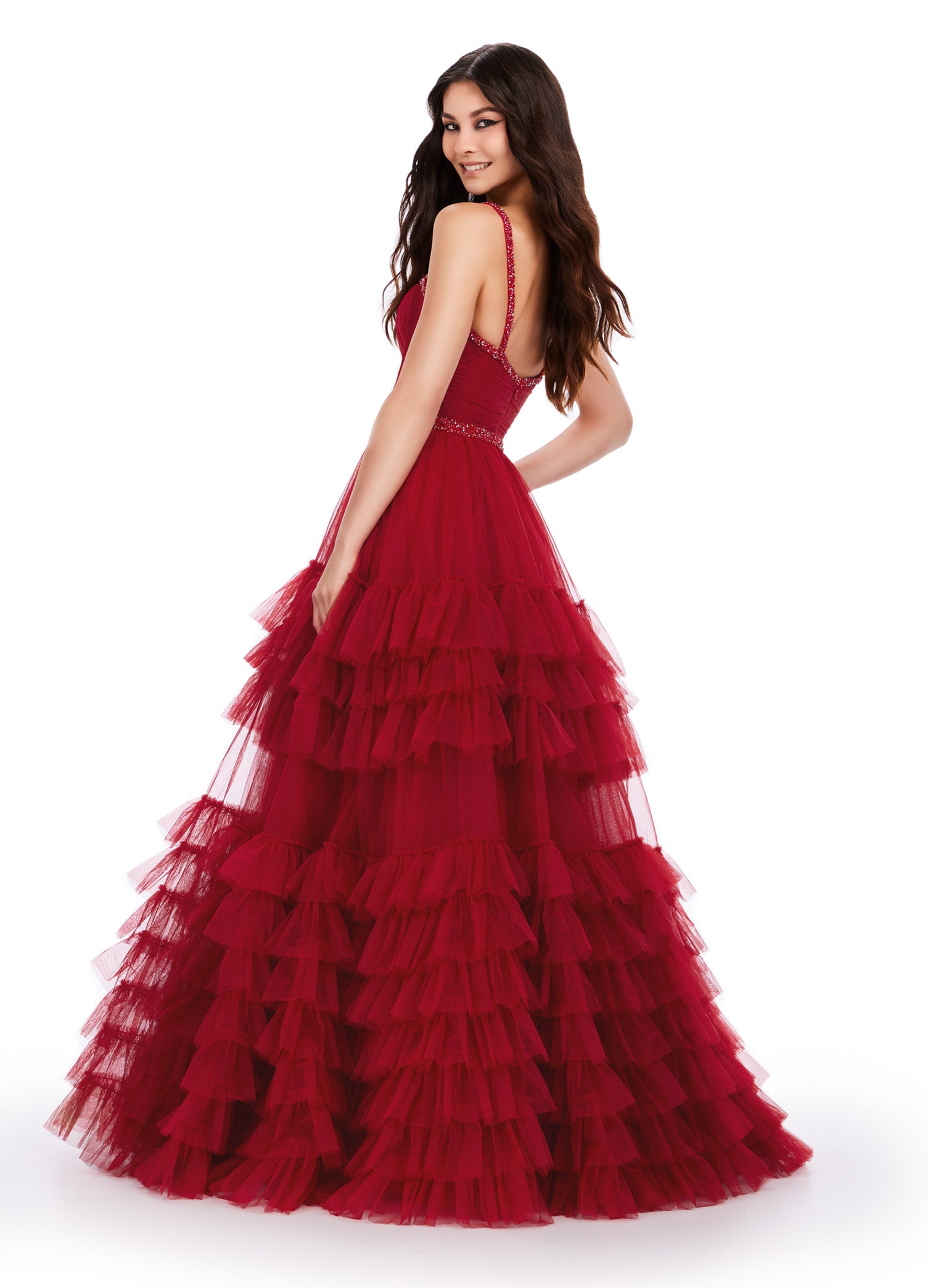 Back View - Red ball gown with a sweetheart neckline, fitted bodice, embellished waistband, and tiered tulle skirt.