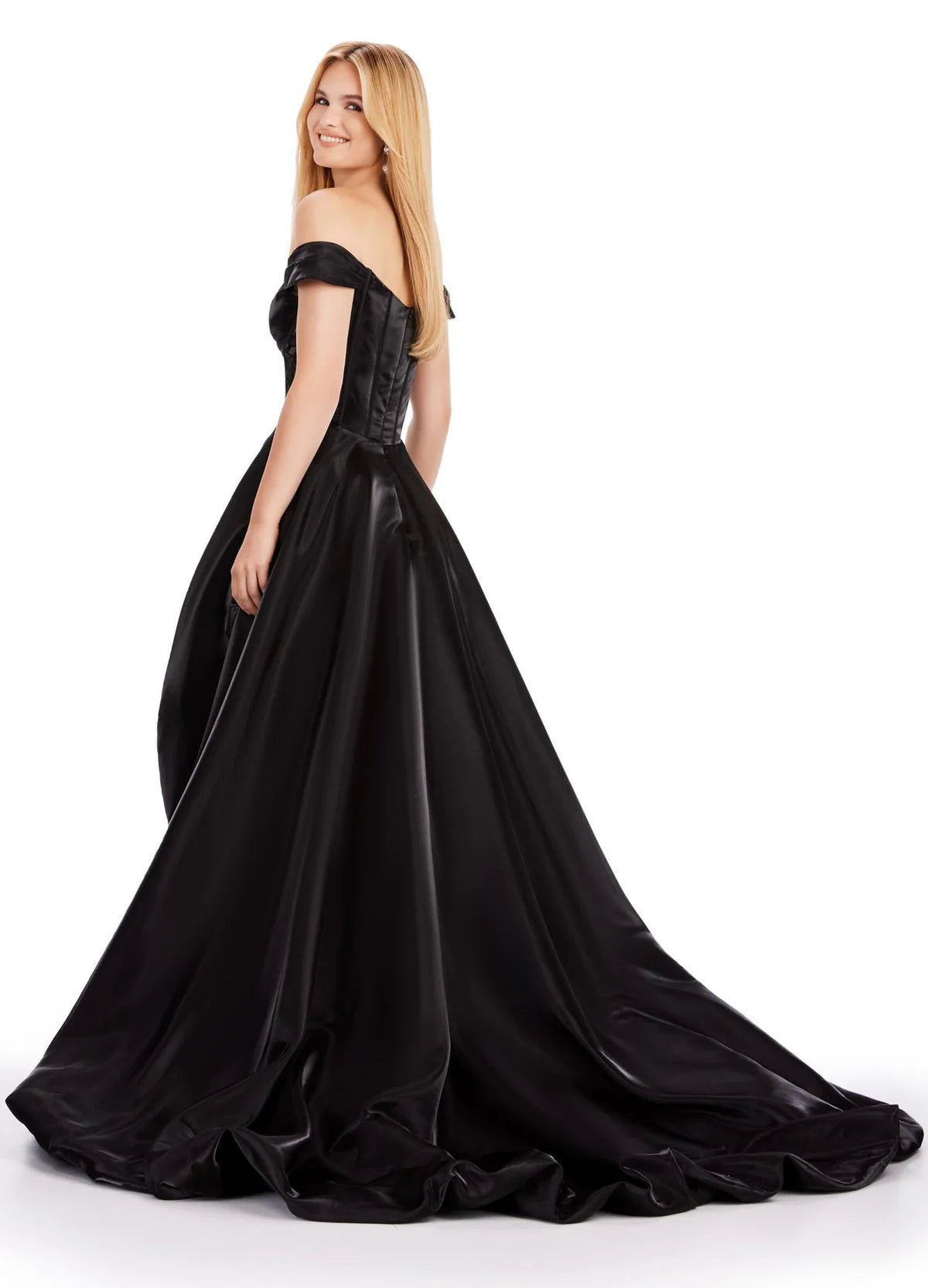 Black satin high-low gown featuring an off-the-shoulder neckline with a plunging corset bodice, a voluminous ruched skirt, and an elegant train for a dramatic and bold look. Back view.