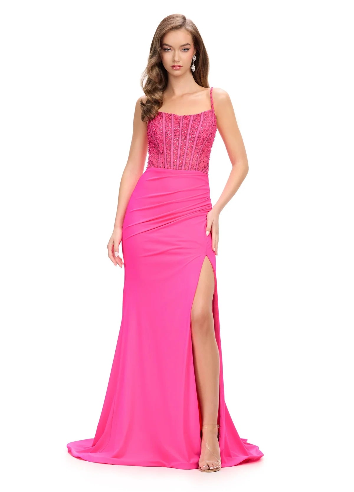 Hot Pink Evening Gown Featuring A Beaded Corset Bodice, Spaghetti Straps, Draped Skirt, And High Side Slit.