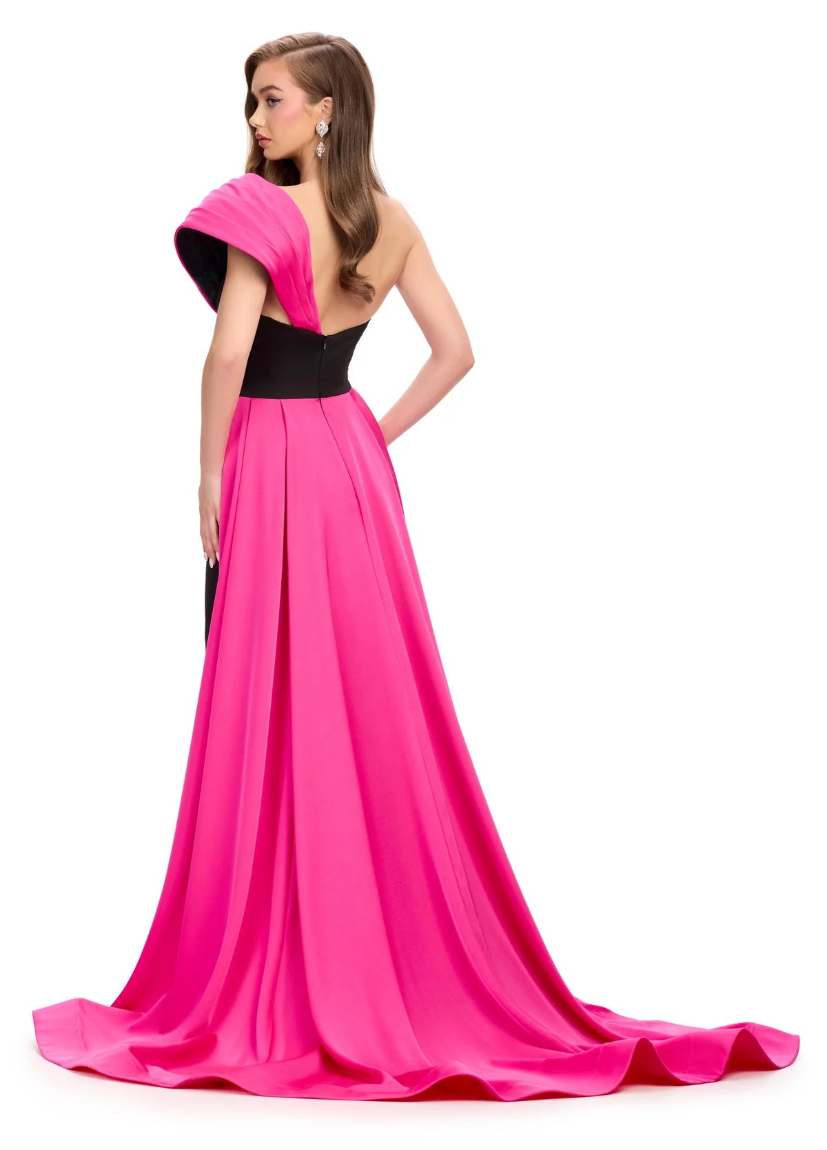 Back View - Black gown with an asymmetrical neckline, fitted silhouette, and dramatic pink off-the-shoulder draping that extends into a floor-length train.