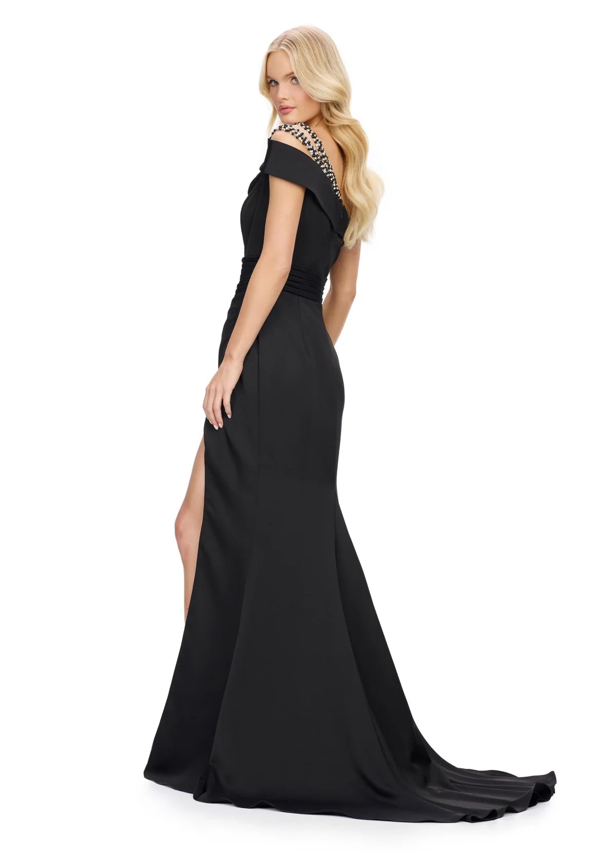 Back view of an alluring one-shoulder black evening gown adorned with pearl embellishments, featuring a ruched bodice, high side slit, and a flowing train for timeless elegance.