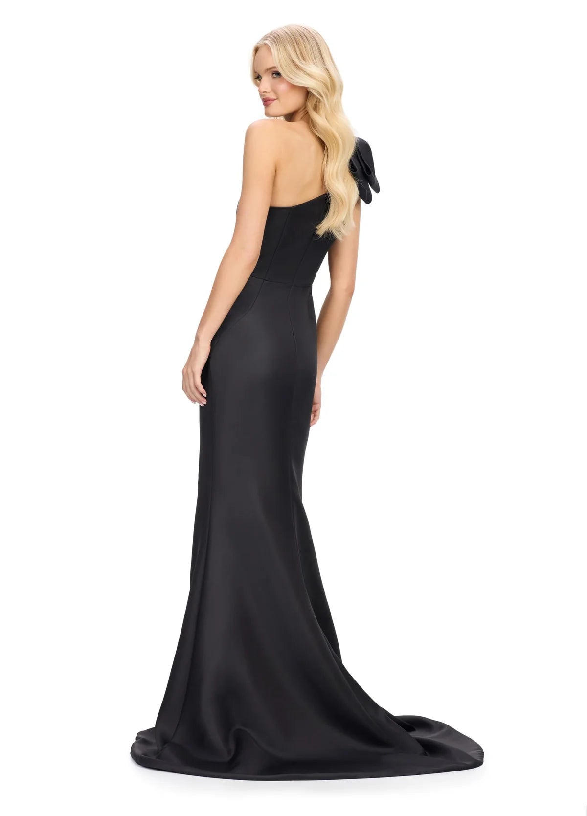 Back view - Elegant black one-shoulder gown with a dramatic oversized bow accent, a figure-flattering silhouette, and a thigh-high slit for a touch of sophistication.