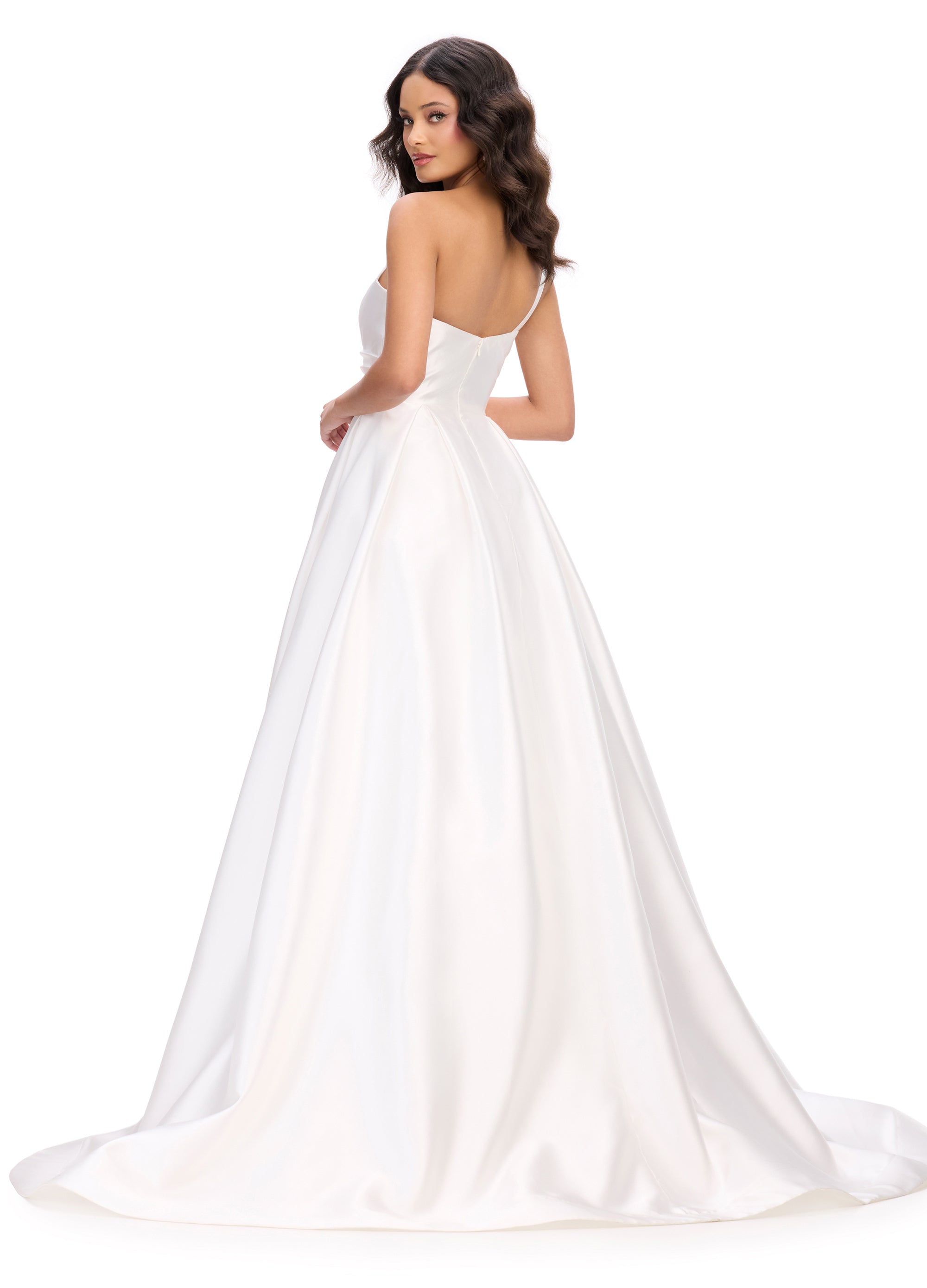 Back view of a stunning white ball gown with a plunging neckline, wrap-style bodice, and a dramatic full skirt, perfect for an unforgettable evening look.