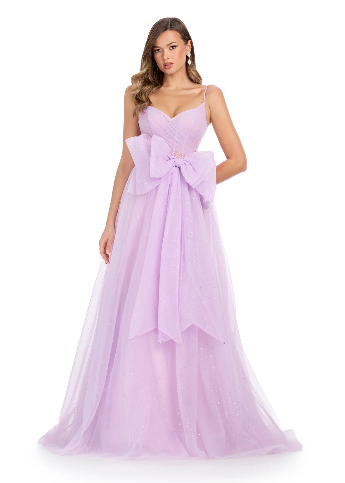 Lilac tulle ball gown with delicate spaghetti straps, a sheer corset bodice, and an oversized bow accent for a fairytale-inspired look.