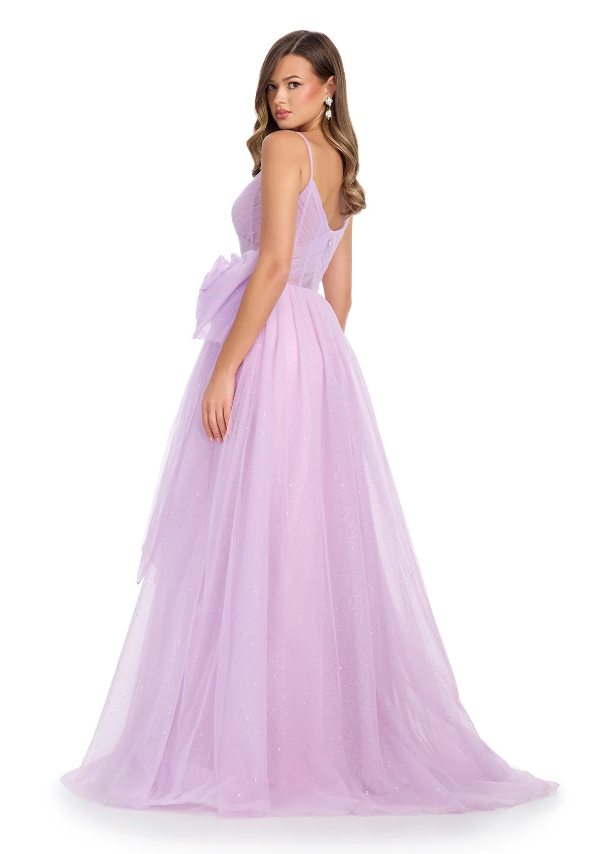 Back view - Lilac tulle ball gown with delicate spaghetti straps, a sheer corset bodice, and an oversized bow accent for a fairytale-inspired look.