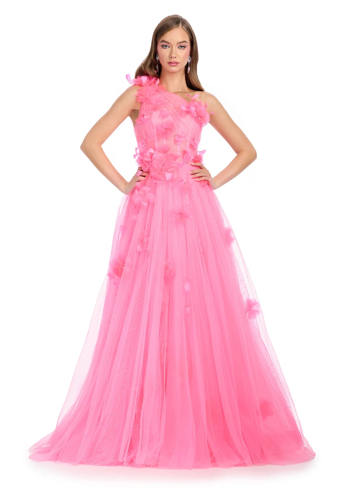 Hot pink one-shoulder ball gown featuring delicate tulle layers adorned with soft floral appliqués, a semi-sheer corset bodice, and a romantic flowy skirt that glimmers subtly, perfect for an enchanting evening.