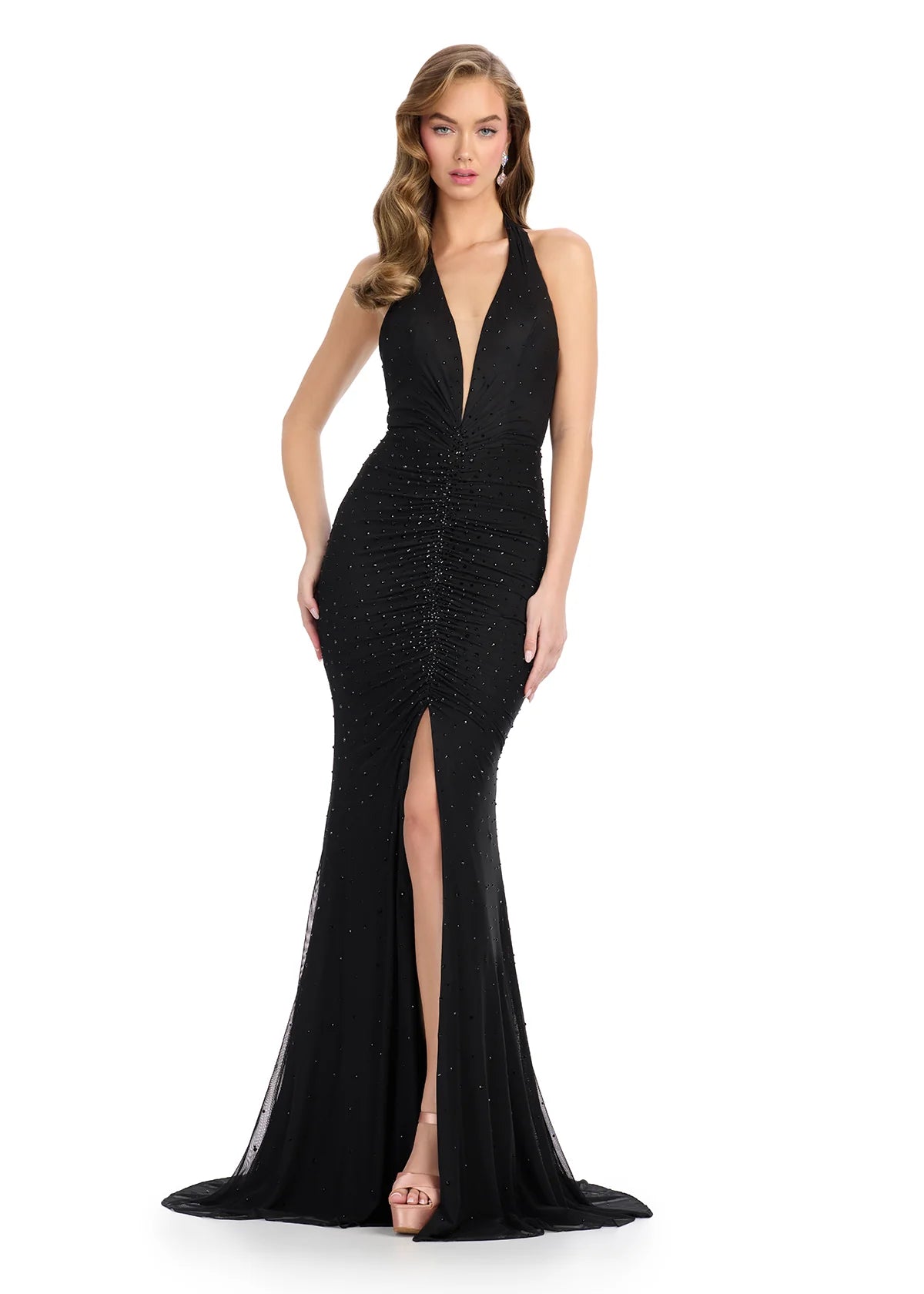 Black halter-neck gown featuring a deep plunging neckline, ruched detailing, subtle embellishments, high slit, and a floor-length silhouette.