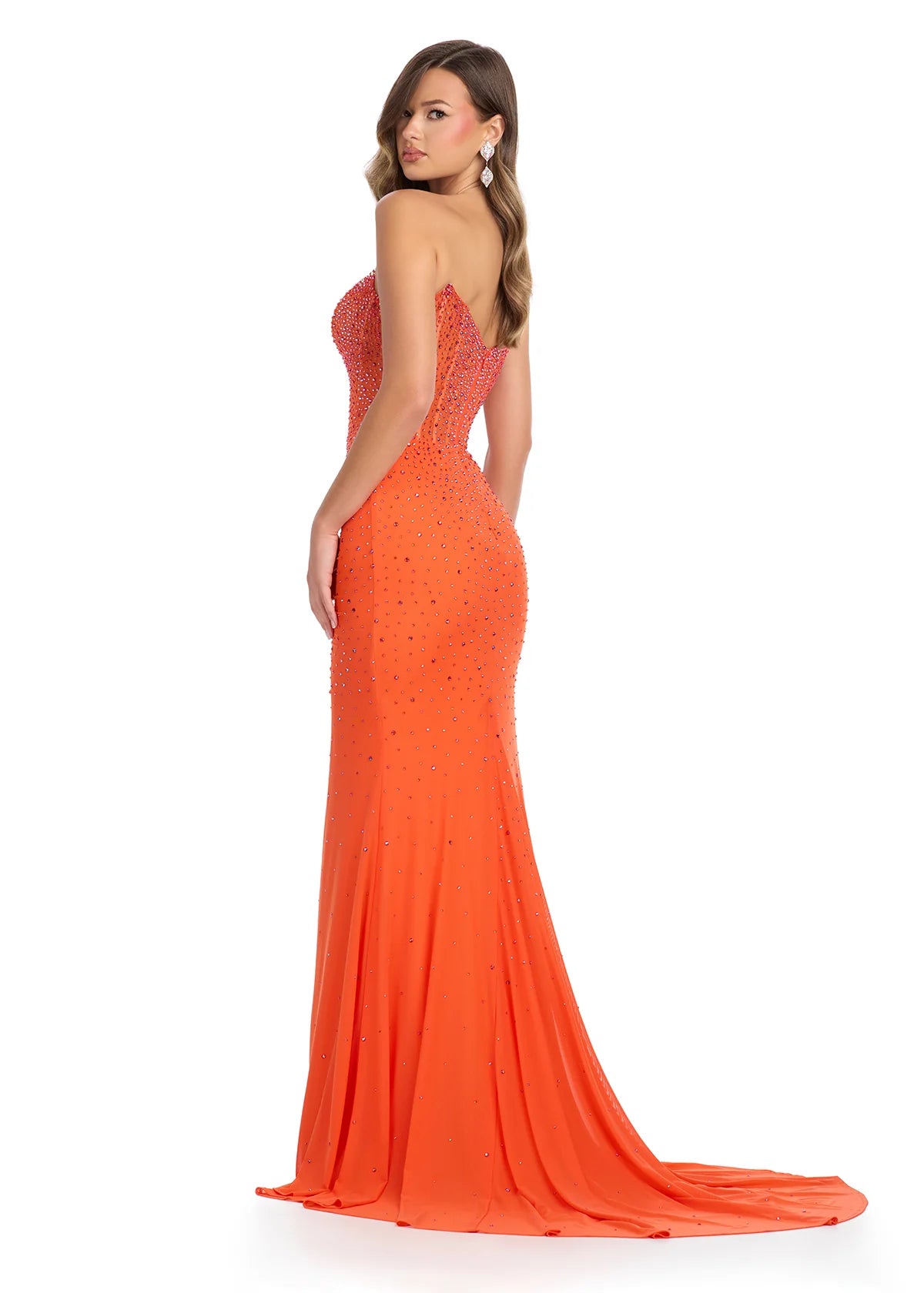 Back View - Strapless orange evening gown adorned with delicate embellishments, featuring a fitted bodice, a thigh-high slit, and a glamorous floor-length design.