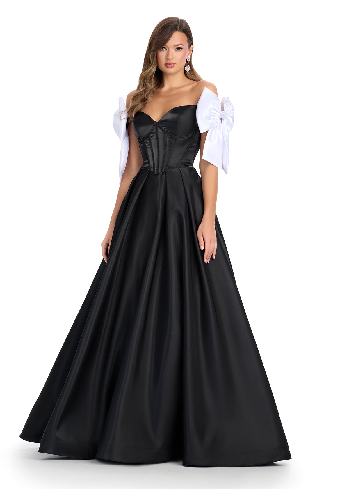 Black satin ball gown with a structured corset bodice, sweetheart neckline, and white bow-accented off-shoulder sleeves.