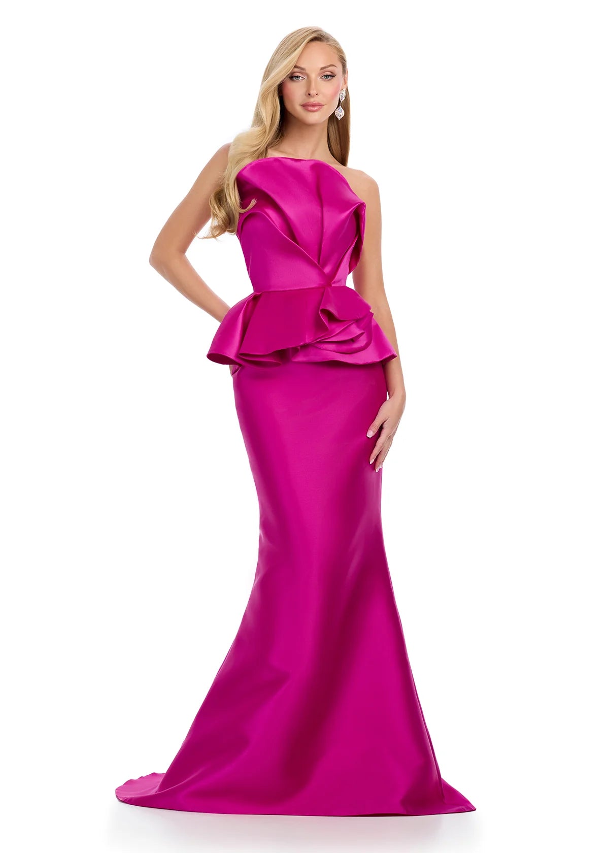 Fuchsia evening gown featuring a strapless white peplum top with sculpted ruffle detailing and a sleek black mermaid skirt for a modern and elegant look.