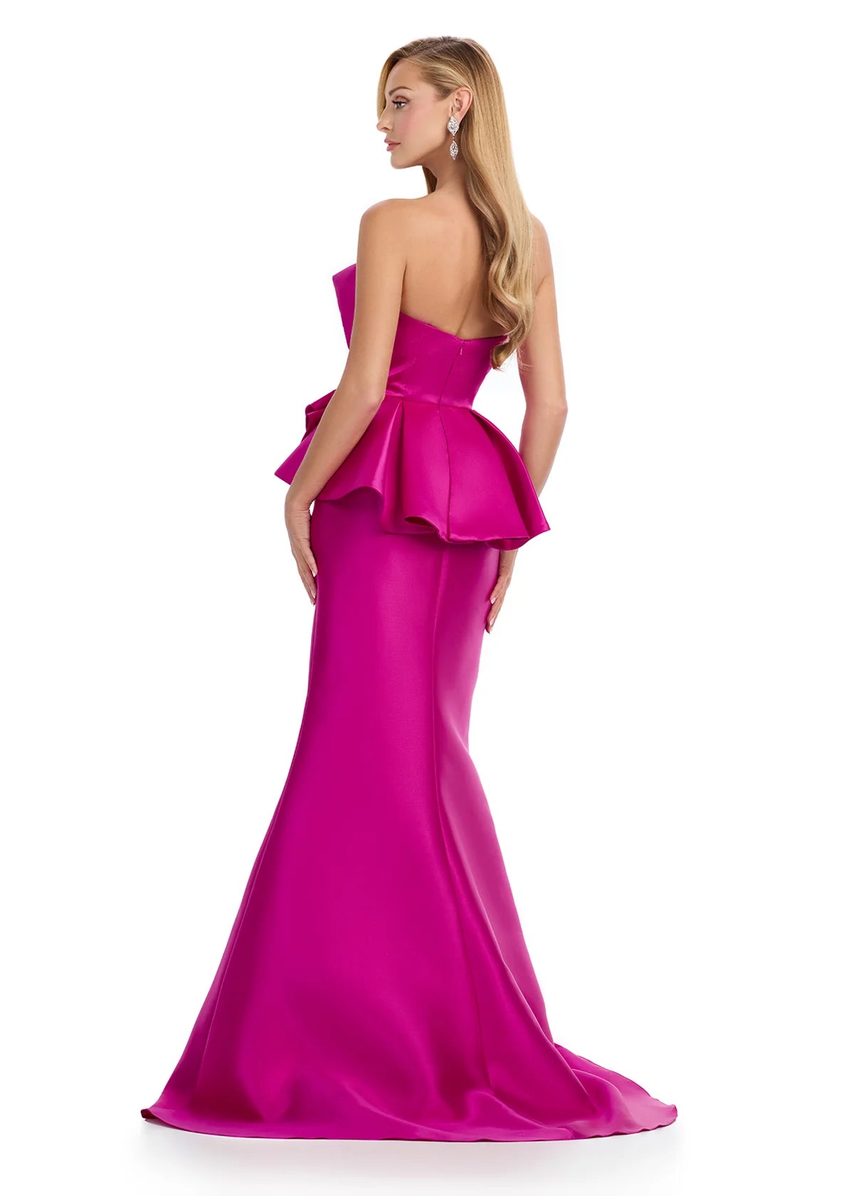 Raspberry evening gown featuring a strapless white peplum top with sculpted ruffle detailing and a sleek black mermaid skirt for a modern and elegant look. Back view.