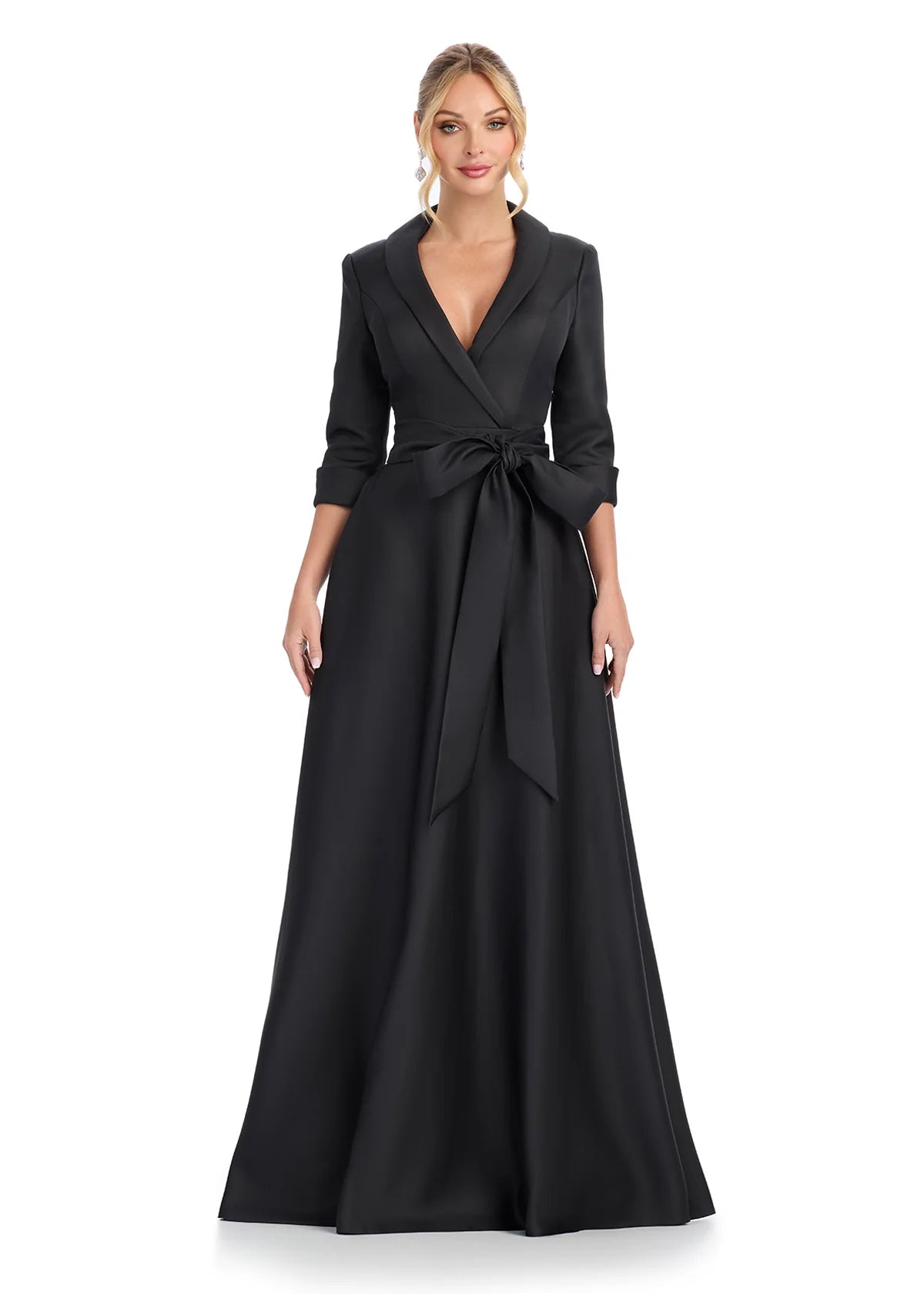 Elegant black evening gown with a tailored blazer-style top, three-quarter sleeves, and a statement waist bow, offering a sophisticated and timeless look for formal events.