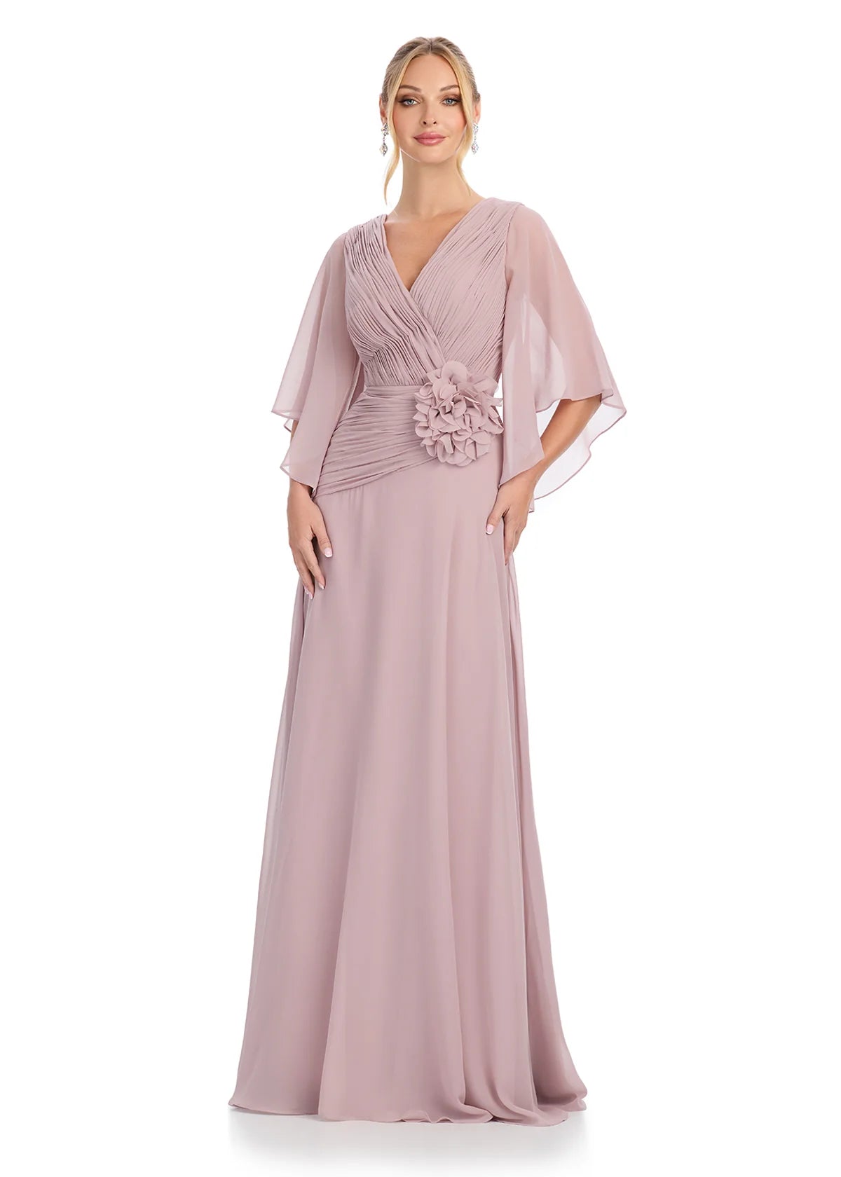 Graceful taupe V-neck gown with flutter sleeves, pleated bodice detailing, and a statement floral embellishment at the waist, offering timeless sophistication.