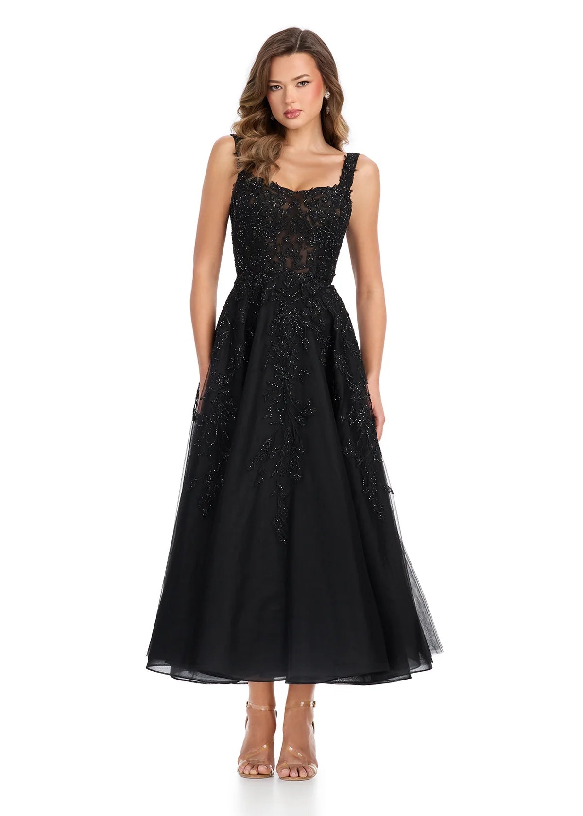 Black midi dress featuring a sheer lace bodice with intricate beadwork, wide straps, and a voluminous A-line skirt, combining sophistication with modern elegance.