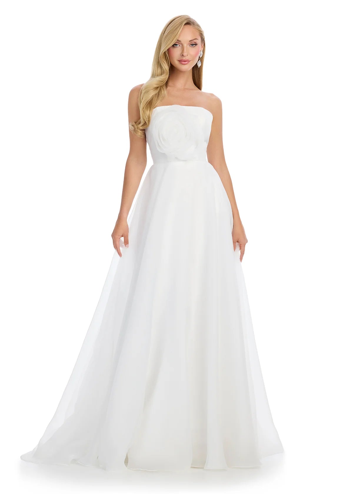 Strapless ivory gown with a large rose detail on the bodice and a flowing A-line silhouette.