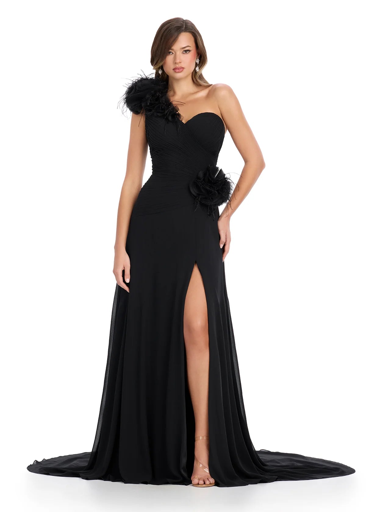 Elegant black one-shoulder gown with feather and floral embellishments, featuring a ruched bodice, thigh-high slit, and flowing train for a dramatic and sophisticated look.