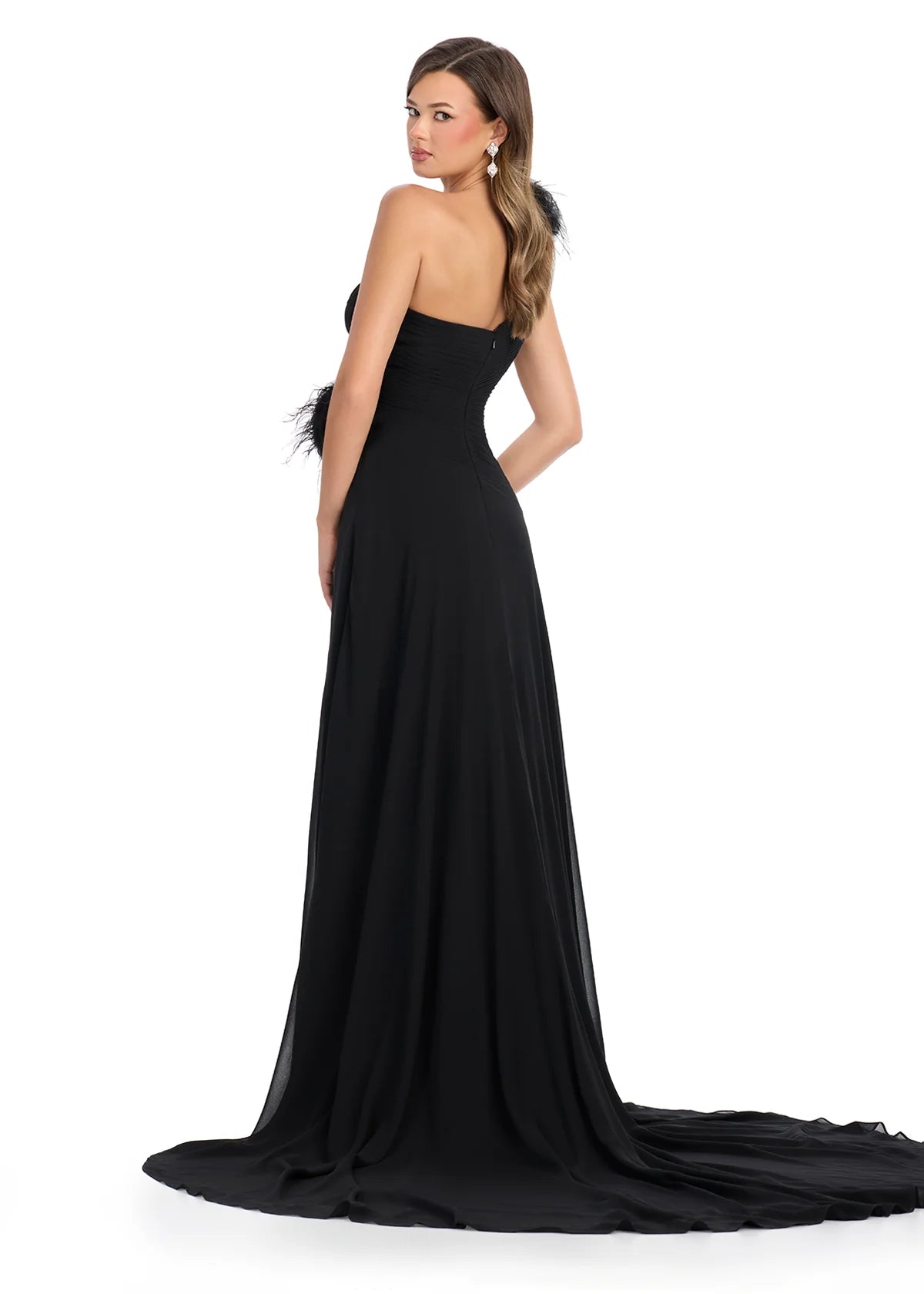 Back view - Elegant black one-shoulder gown with feather and floral embellishments, featuring a ruched bodice, thigh-high slit, and flowing train for a dramatic and sophisticated look.