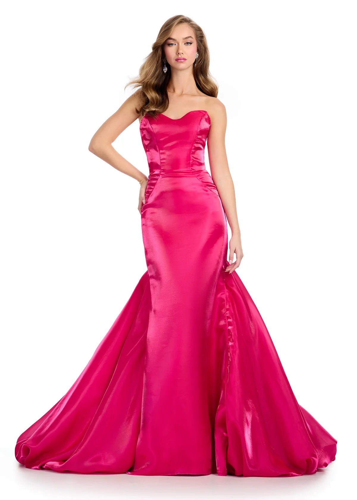 Pink elegant mermaid gown crafted from lustrous fabric, featuring a classic strapless neckline and a dramatic flared skirt for a timeless silhouette.