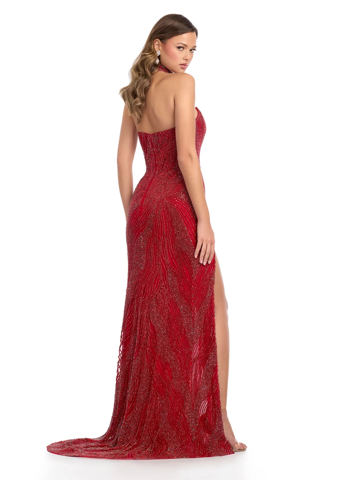 Back view - Shimmering red beaded gown featuring a high neck collar, flowing linear embellishments, and a sultry thigh-high slit for a timelessly elegant look.