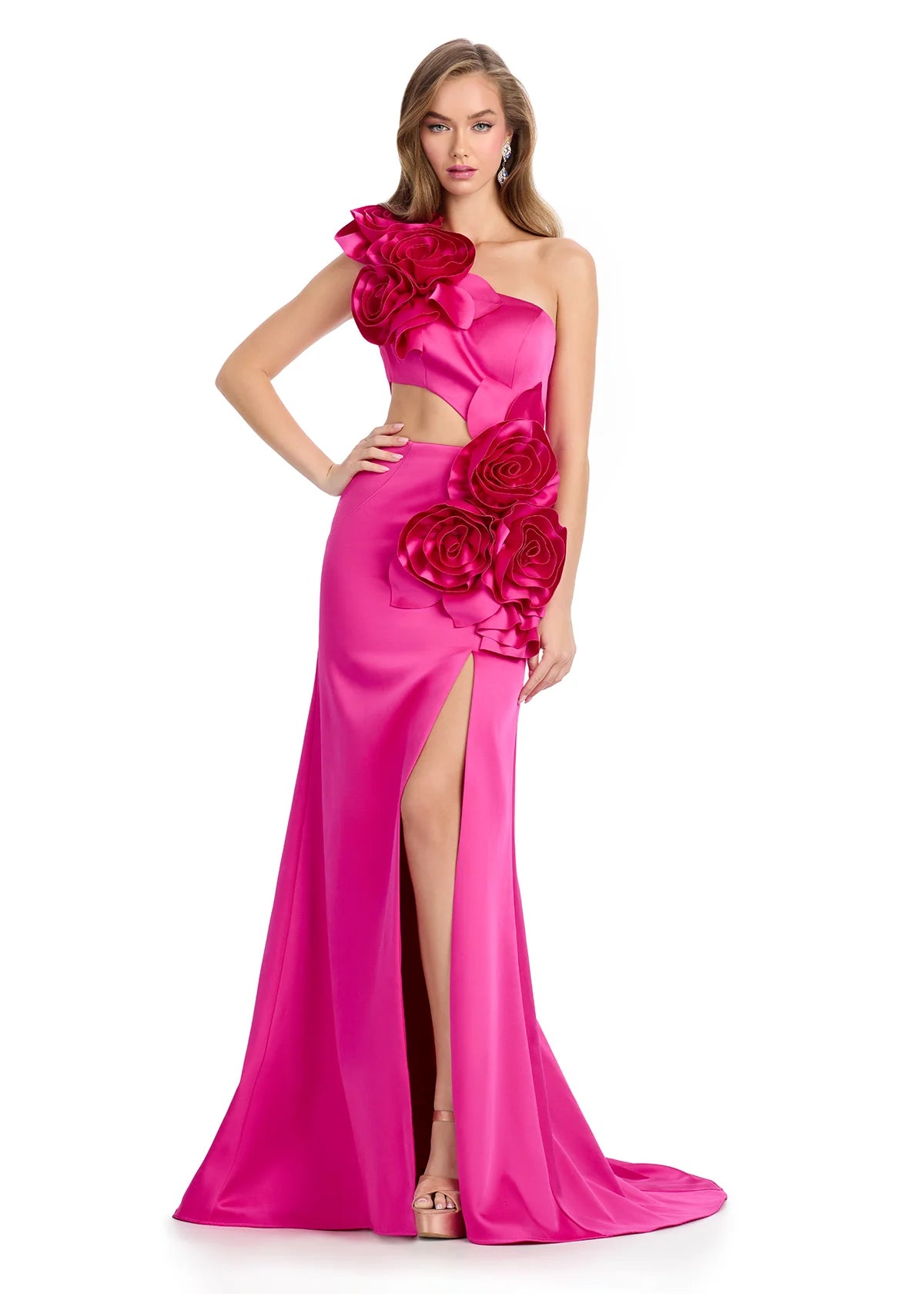 Fuchsia gown with an asymmetrical neckline, large rose accents, side cut-out, high slit, and a floor-length fitted silhouette.