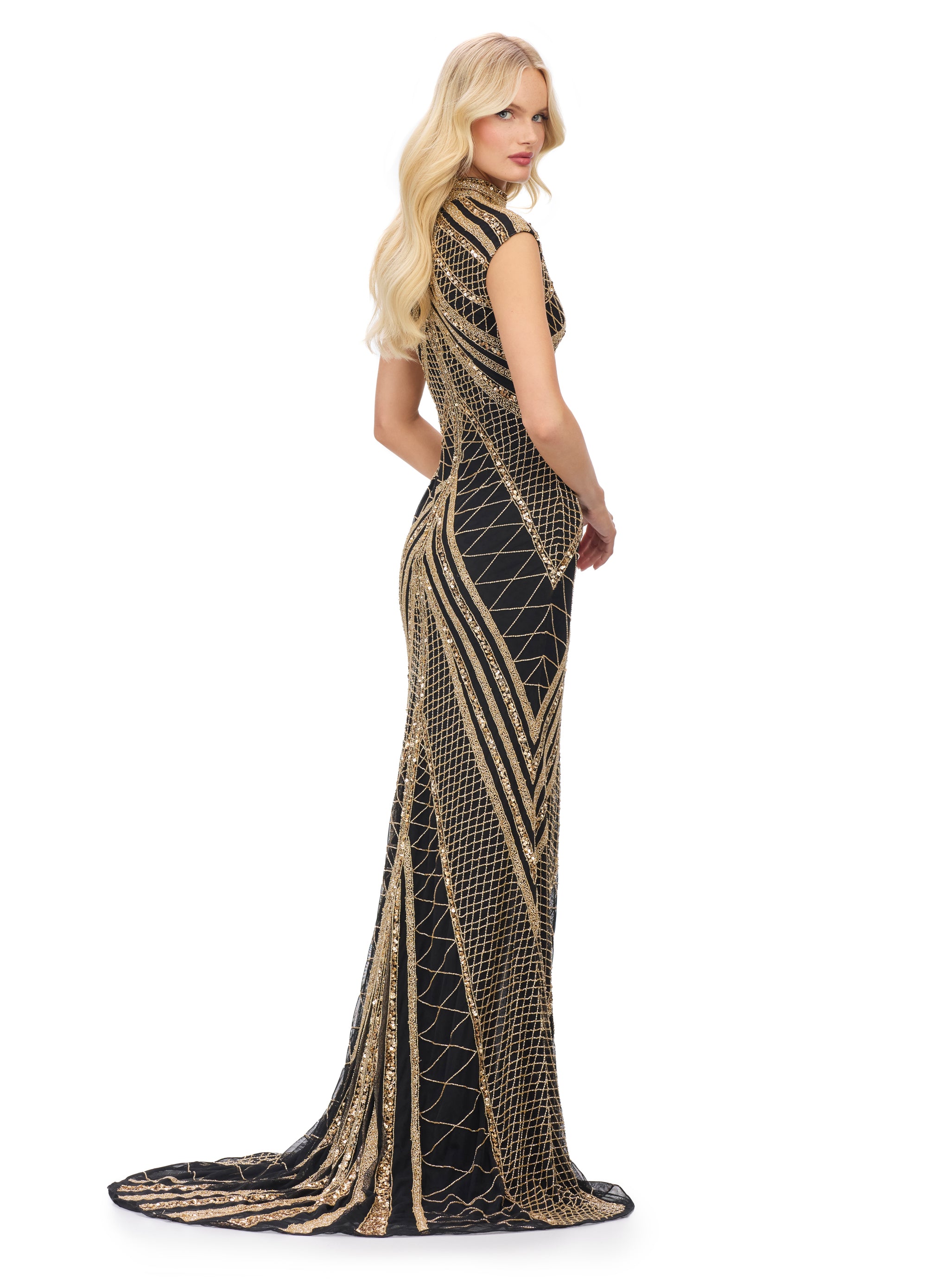 Back view - Black and gold geometric gown with intricate beadwork, a high neckline, and cap sleeves, designed with a dramatic front slit for a striking and elegant look.