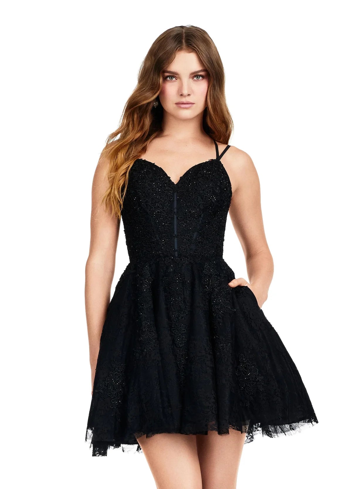 Black lace mini dress featuring a sweetheart neckline, fitted bodice, and flared skirt with delicate detailing.