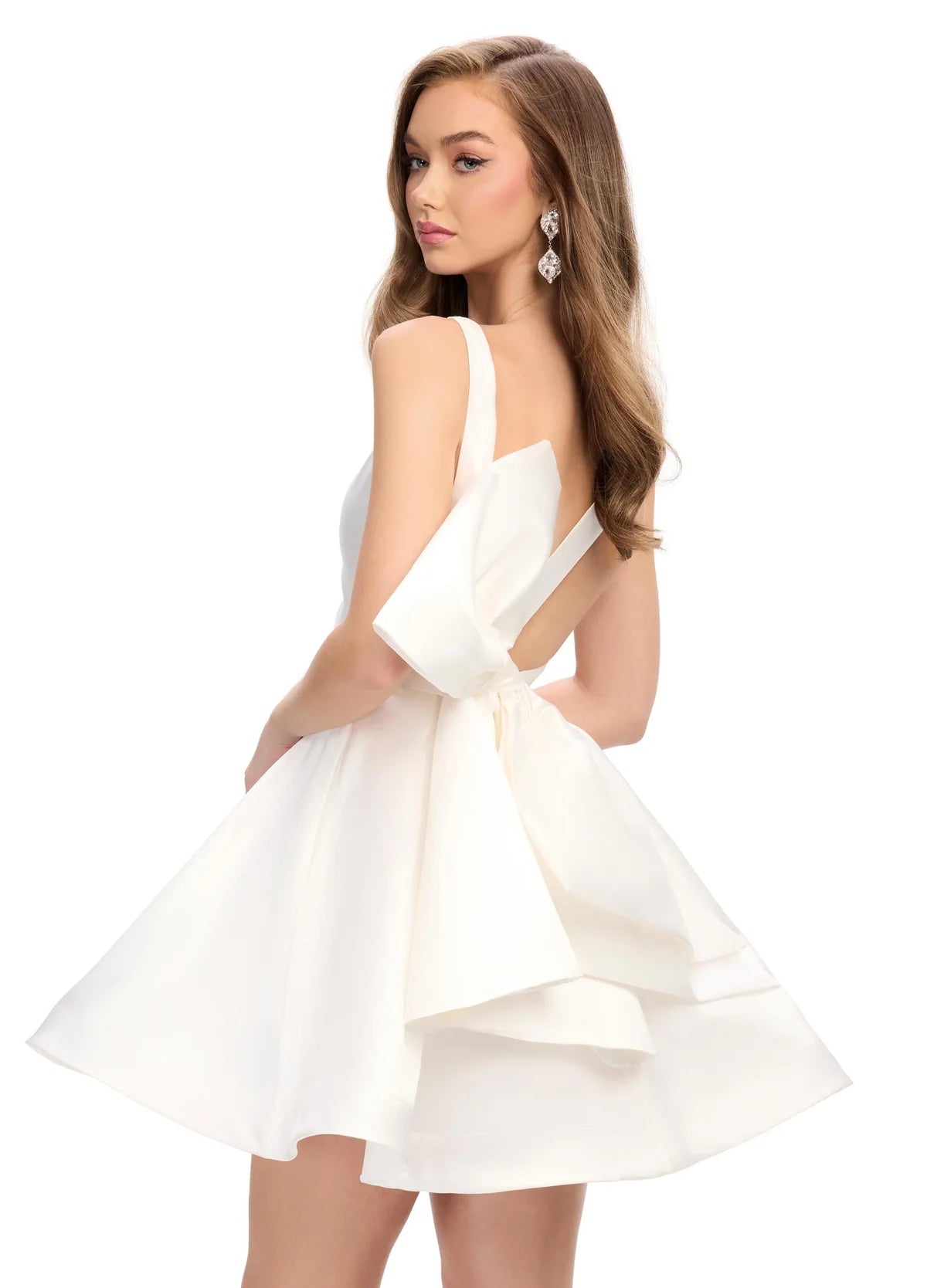 Back View - White sleeveless A-line cocktail dress featuring a deep V-neckline, fitted bodice, and a voluminous short skirt with subtle pleats, creating a playful and elegant look.