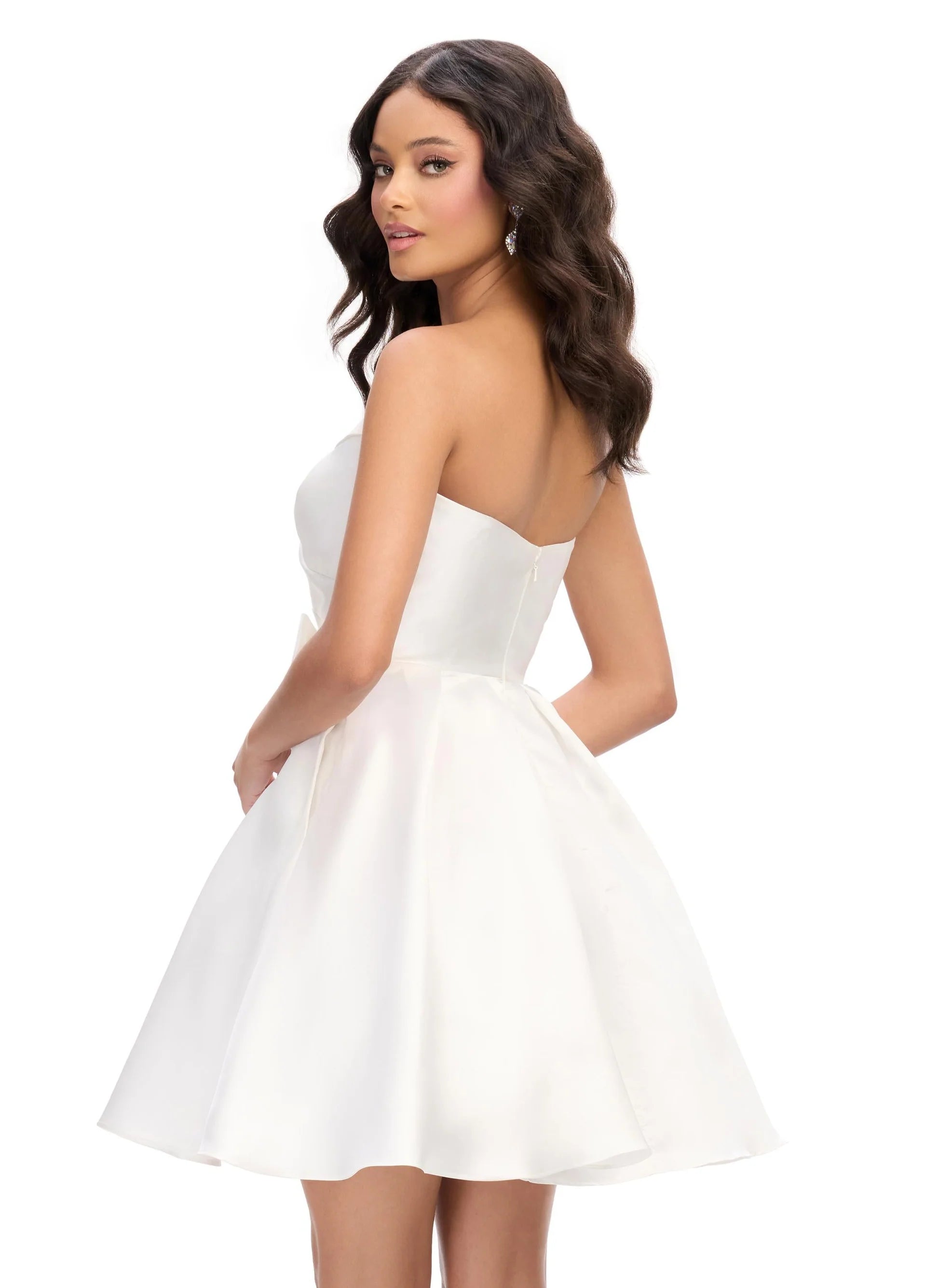 Back View - Strapless white mini dress featuring a sweetheart neckline, pleated bodice, and oversized bow accent for a playful and elegant look.