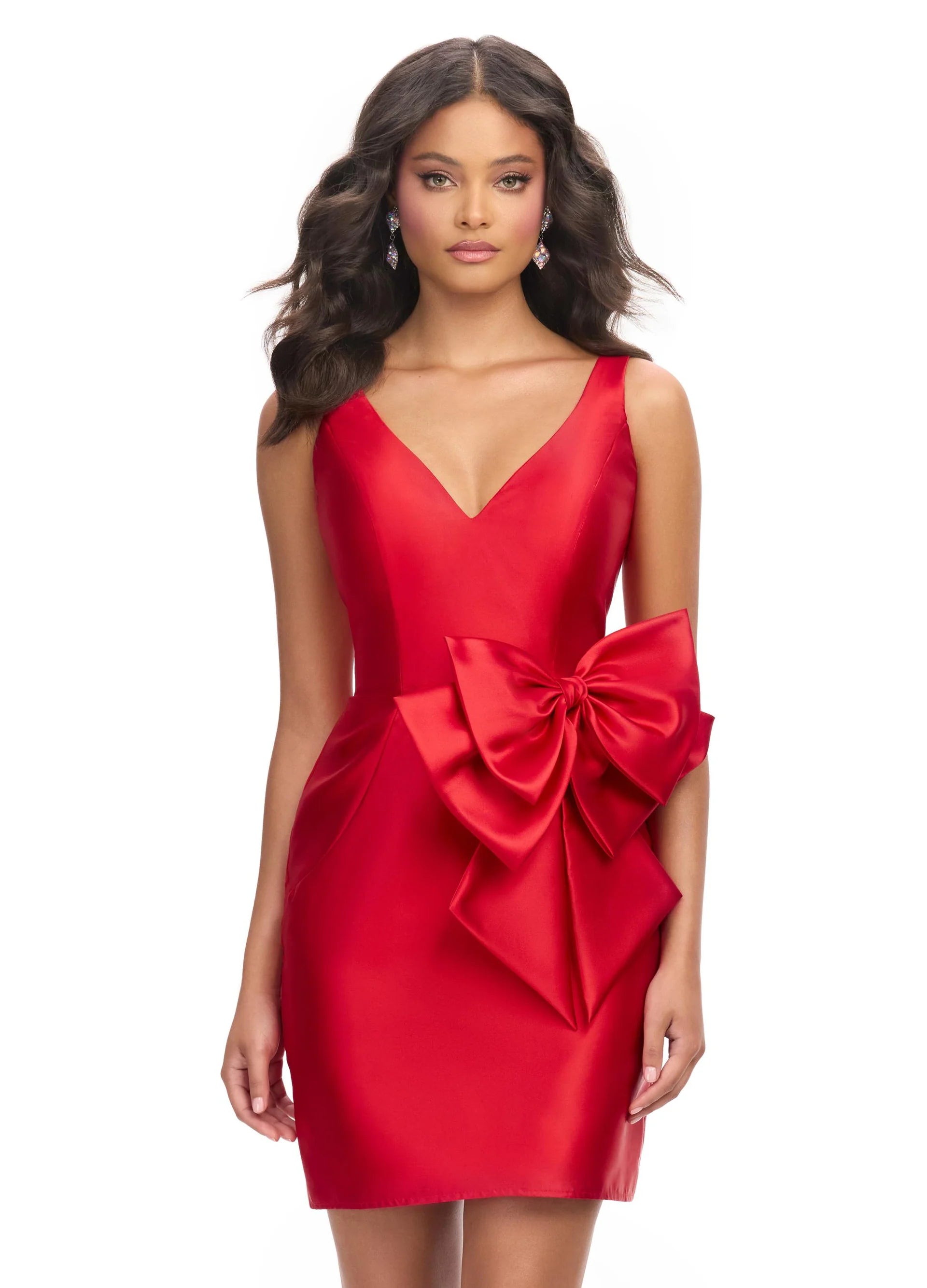 Chic red mini dress featuring a plunging V-neckline, sleek silhouette, and an oversized statement bow at the waist for a touch of elegance and charm.